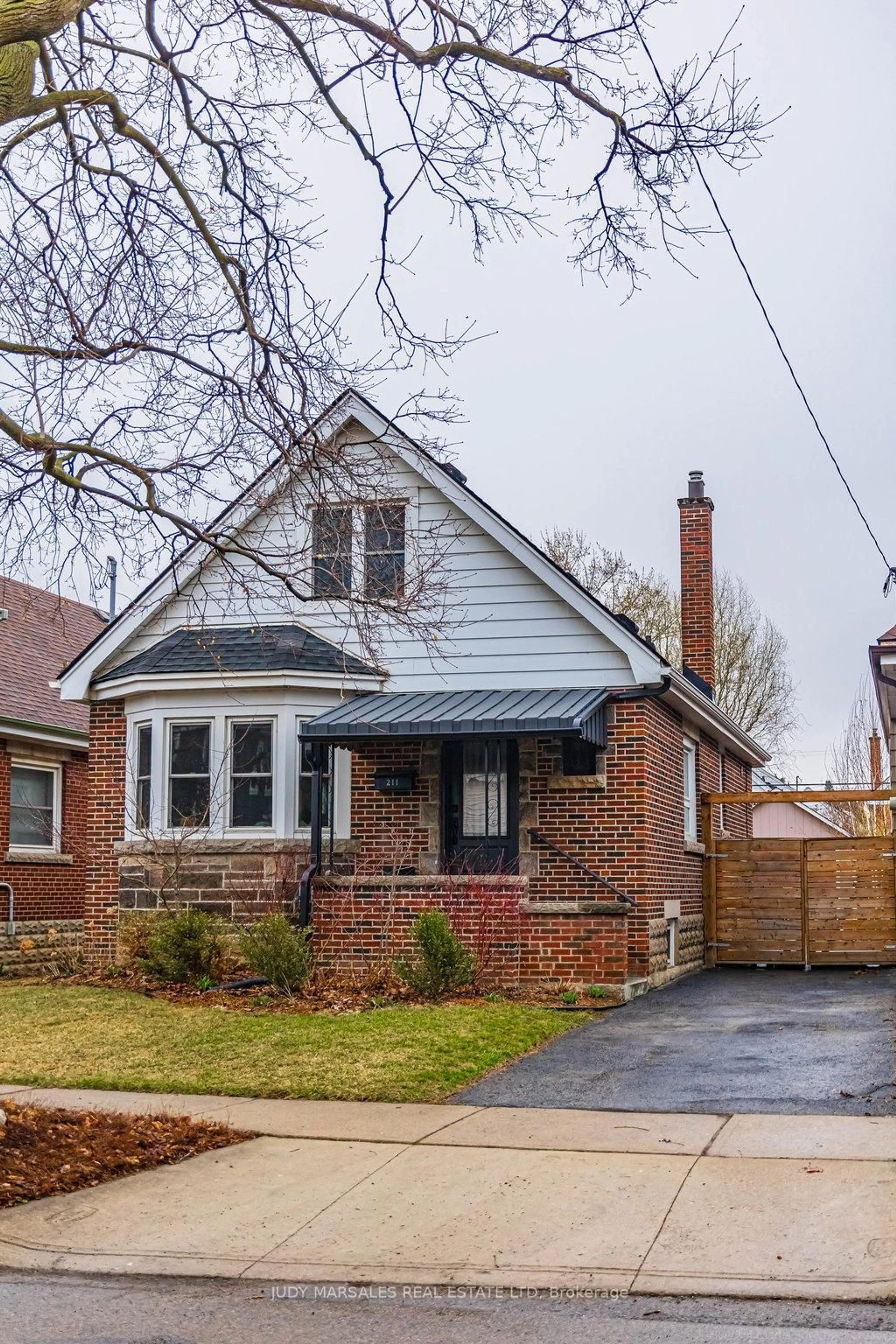 Home with brick exterior material, street for 211 Wexford Ave, Hamilton Ontario L8K 2P1
