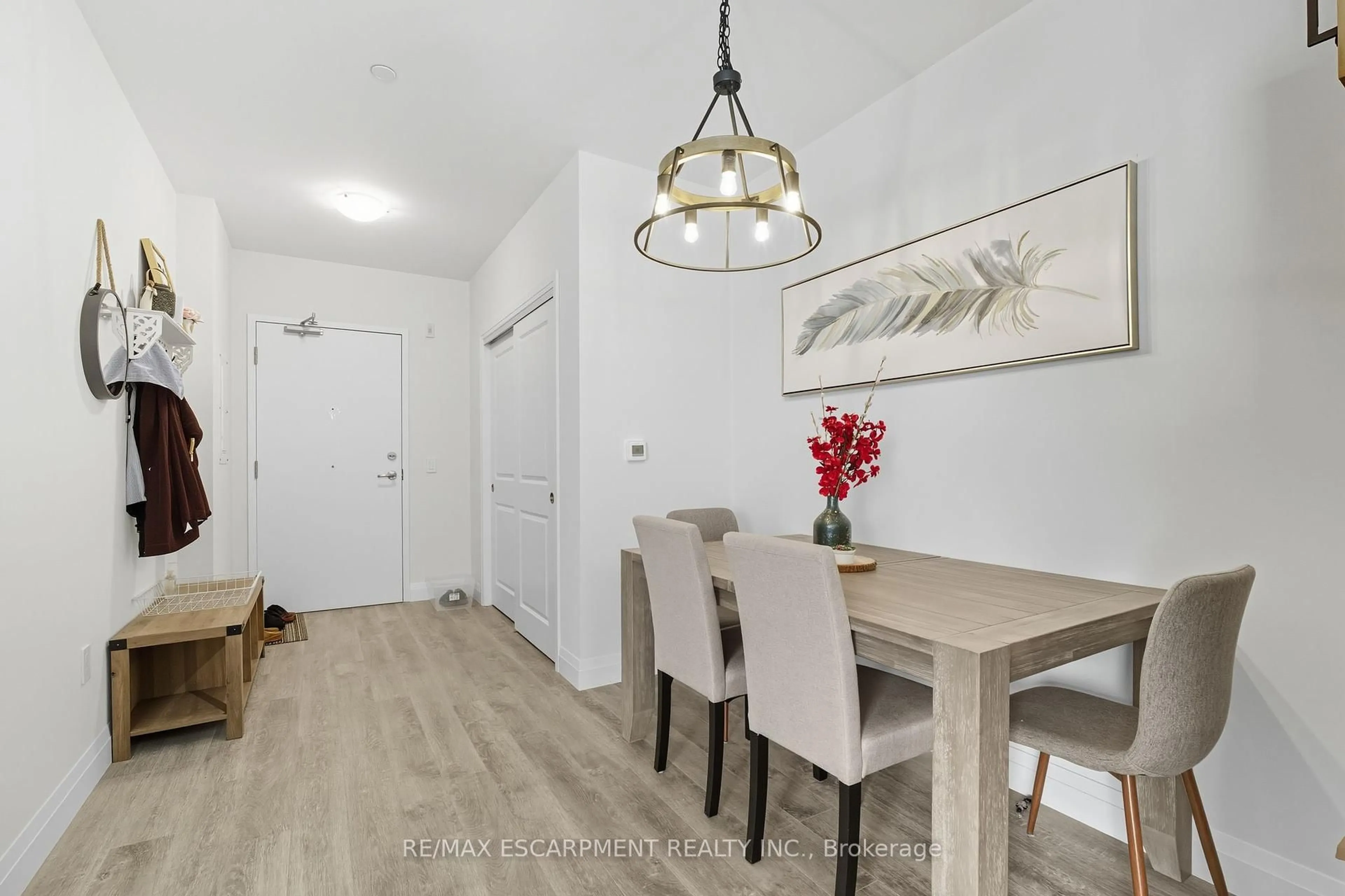 Dining room, wood/laminate floor for 1 Redfern Ave #426, Hamilton Ontario L9C 0E6