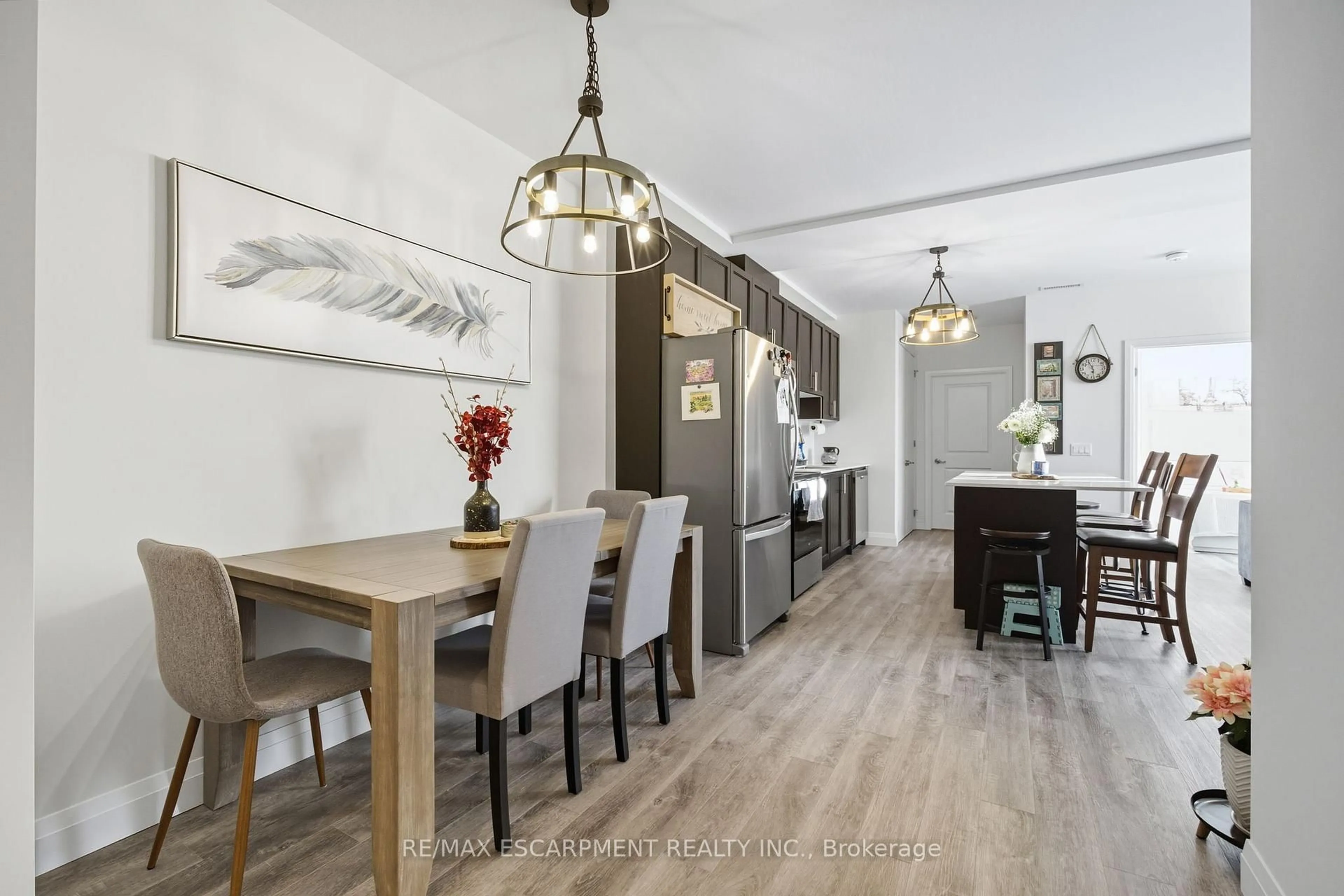 Open concept kitchen, wood/laminate floor for 1 Redfern Ave #426, Hamilton Ontario L9C 0E6