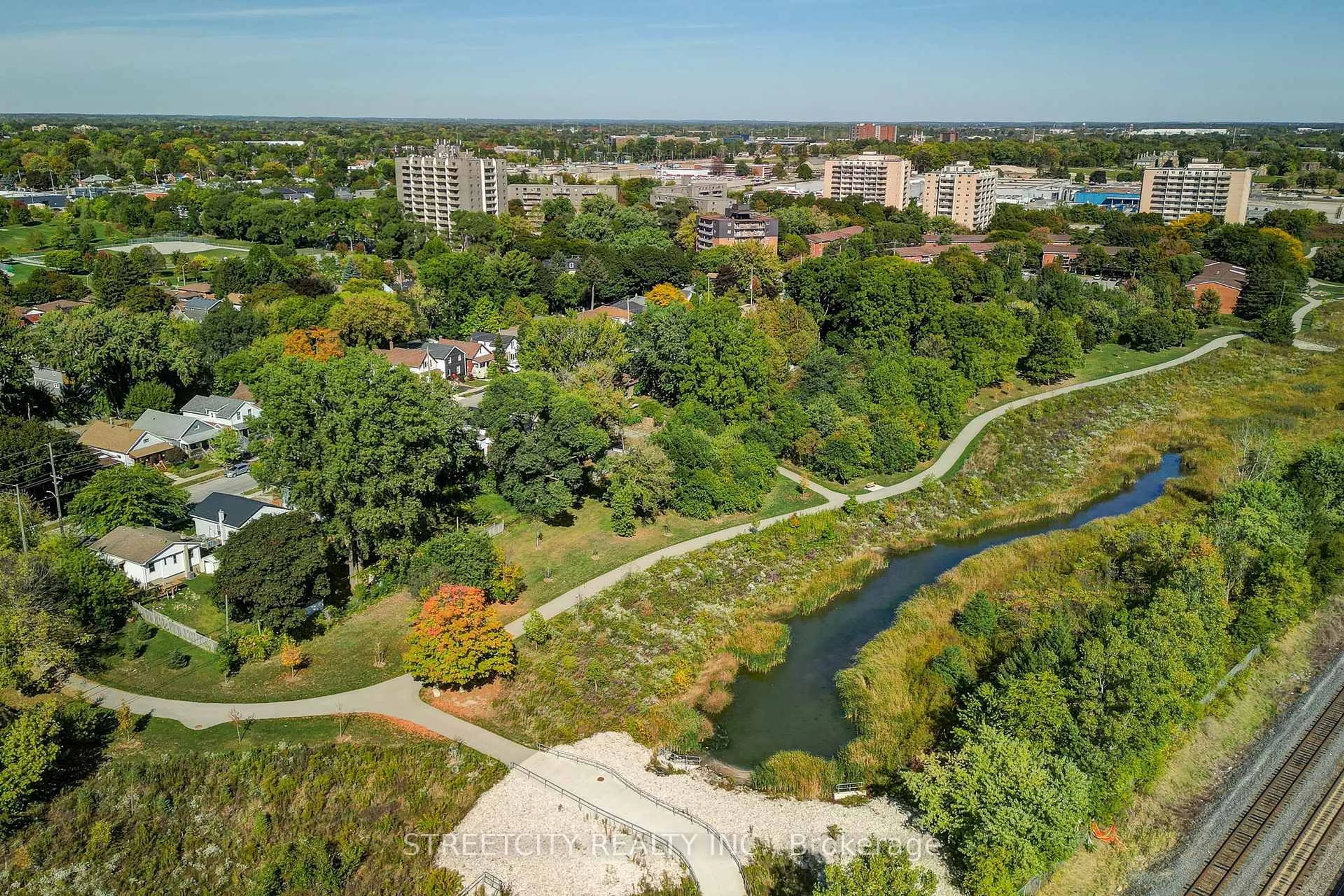 A pic from outside/outdoor area/front of a property/back of a property/a pic from drone, water/lake/river/ocean view for 71 Connaught Ave, London East Ontario N5Y 3A5