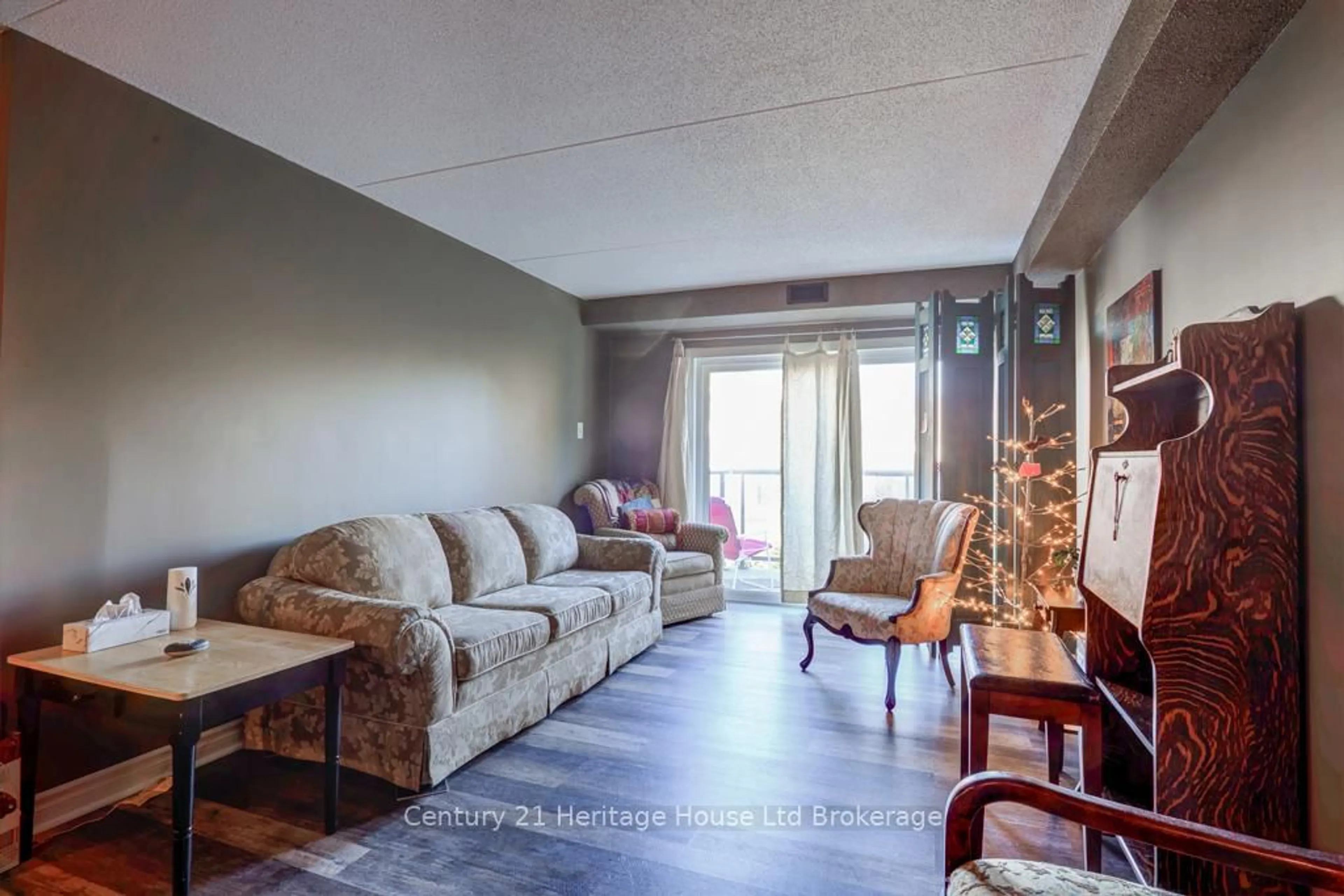 Living room with furniture, unknown for 163 Ferguson Dr #106, Woodstock Ontario N4V 1B1