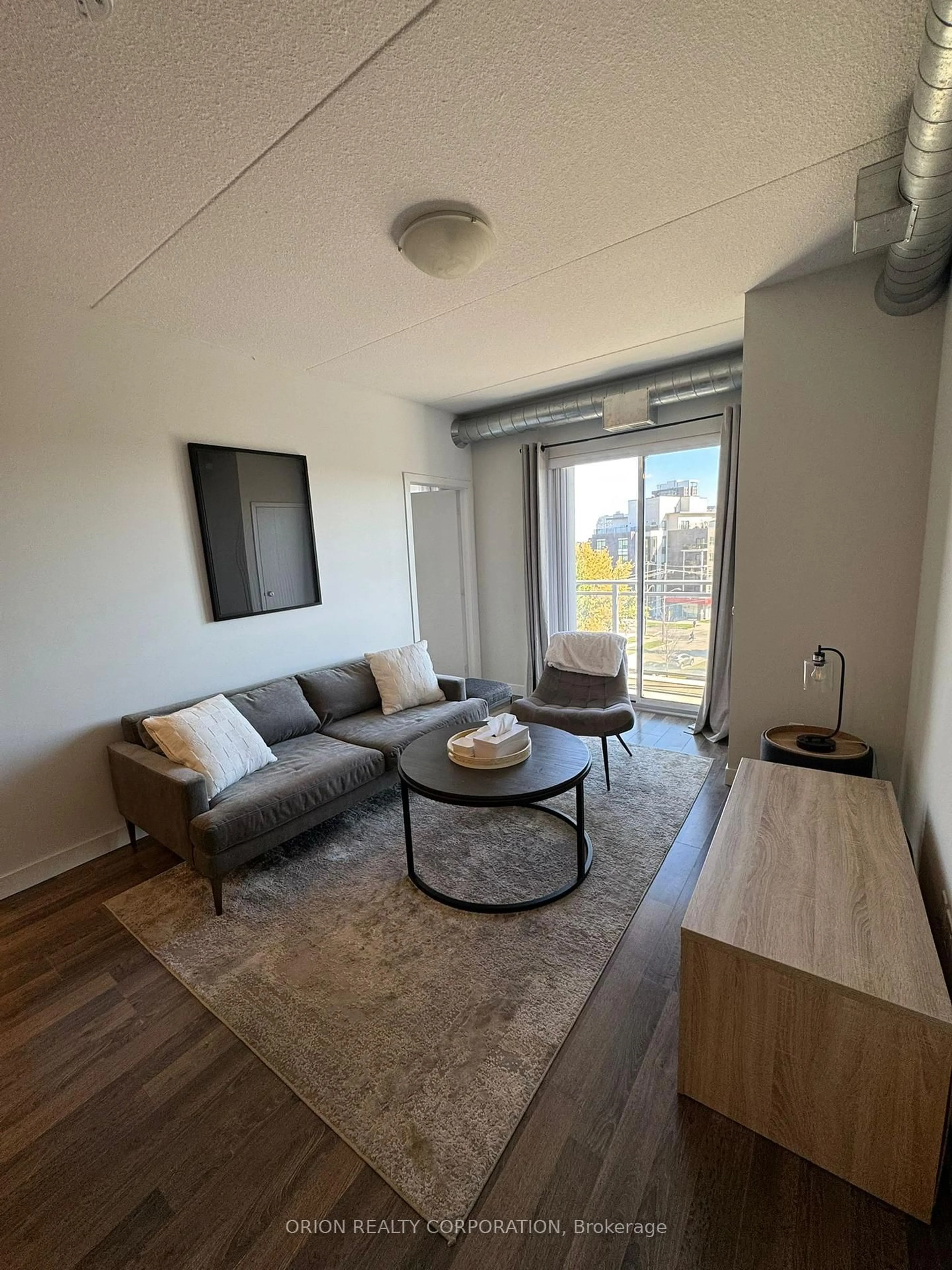 Living room with furniture, wood/laminate floor for 62 Balsam St #H405, Waterloo Ontario N2L 3H2