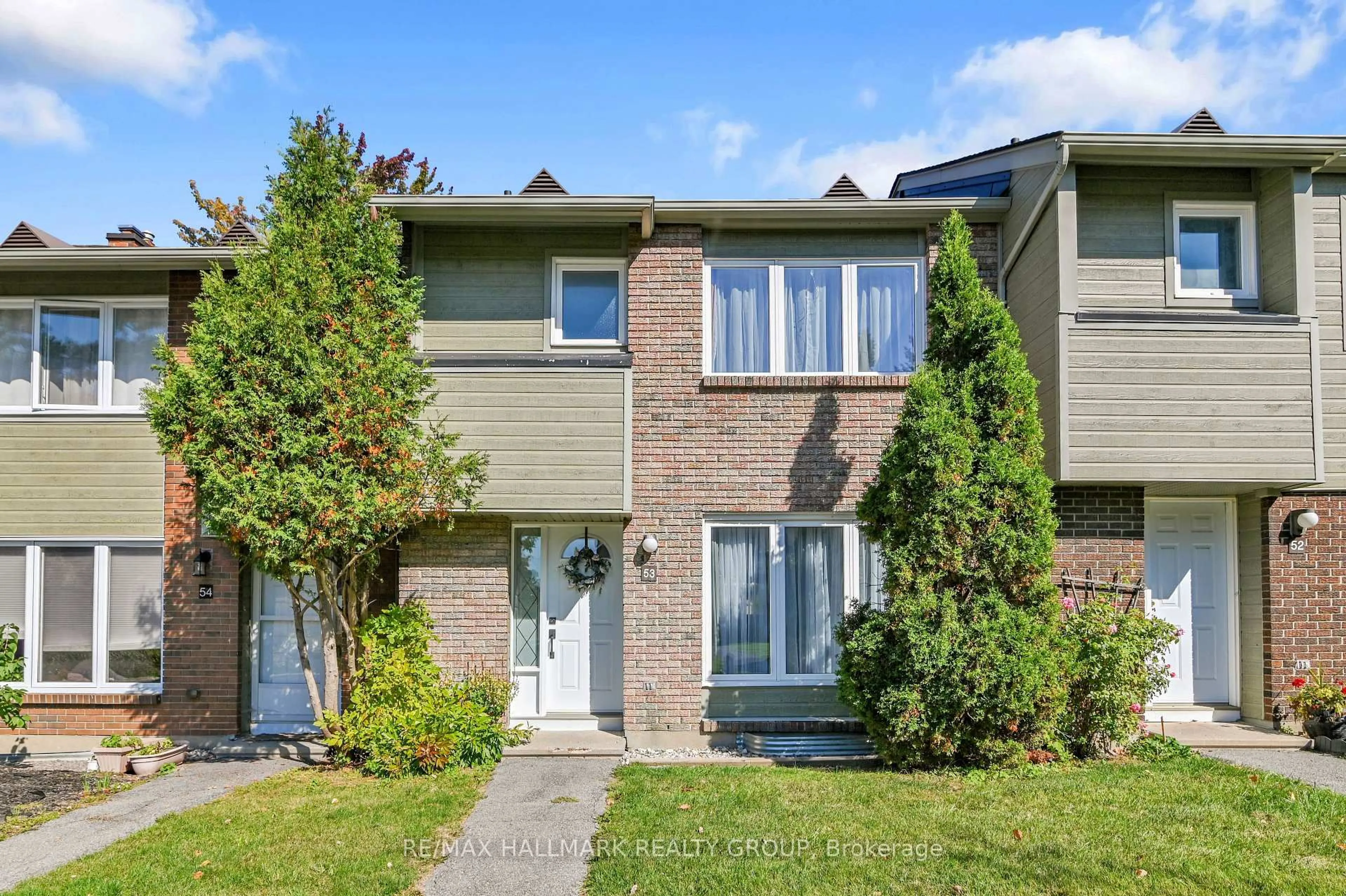 Home with vinyl exterior material, street for 21 Midland Cres #53, Ottawa Ontario K2H 8P6