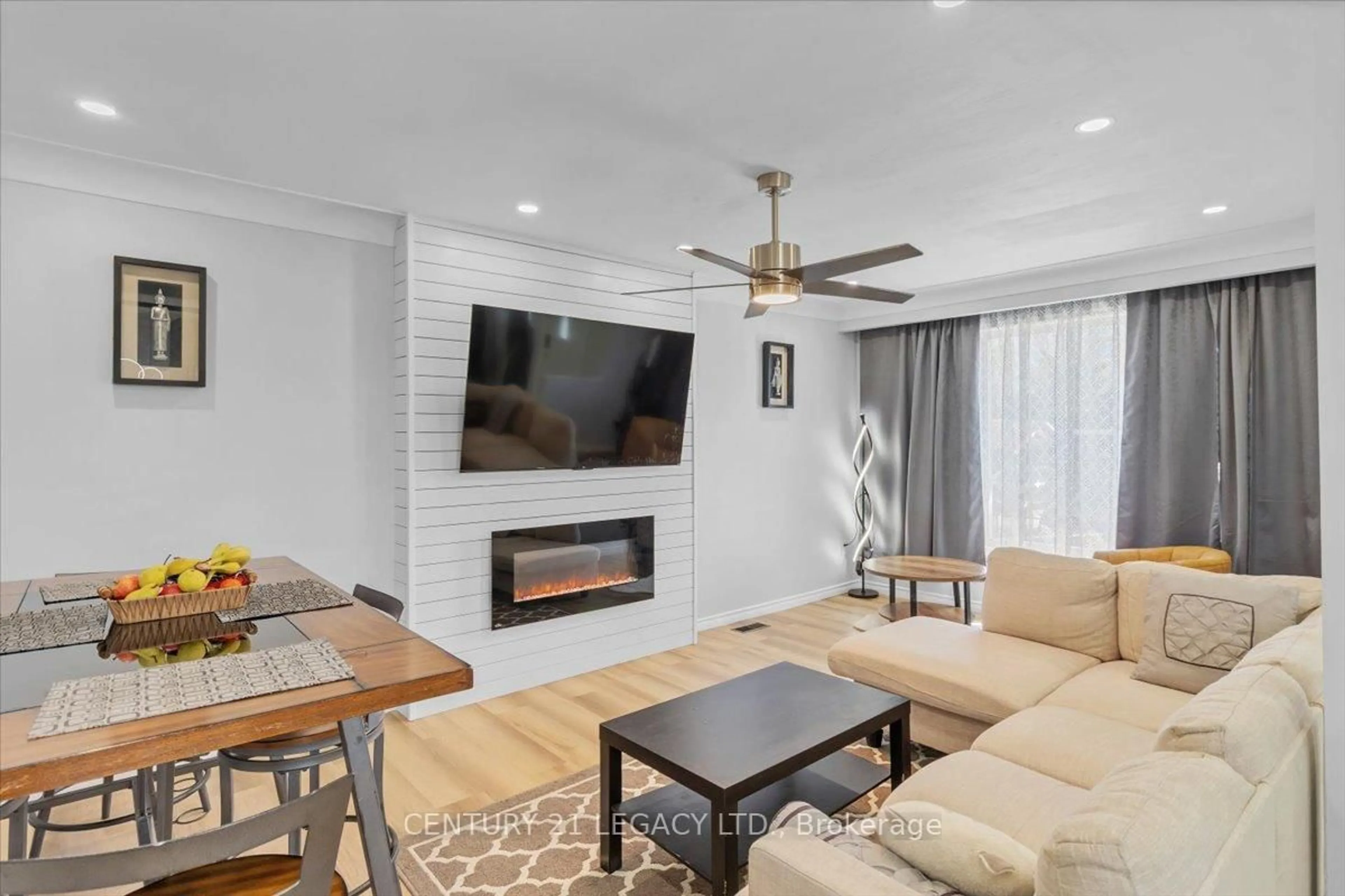 Living room with furniture, wood/laminate floor for 54 Beland Ave, Hamilton Ontario L8H 1B8