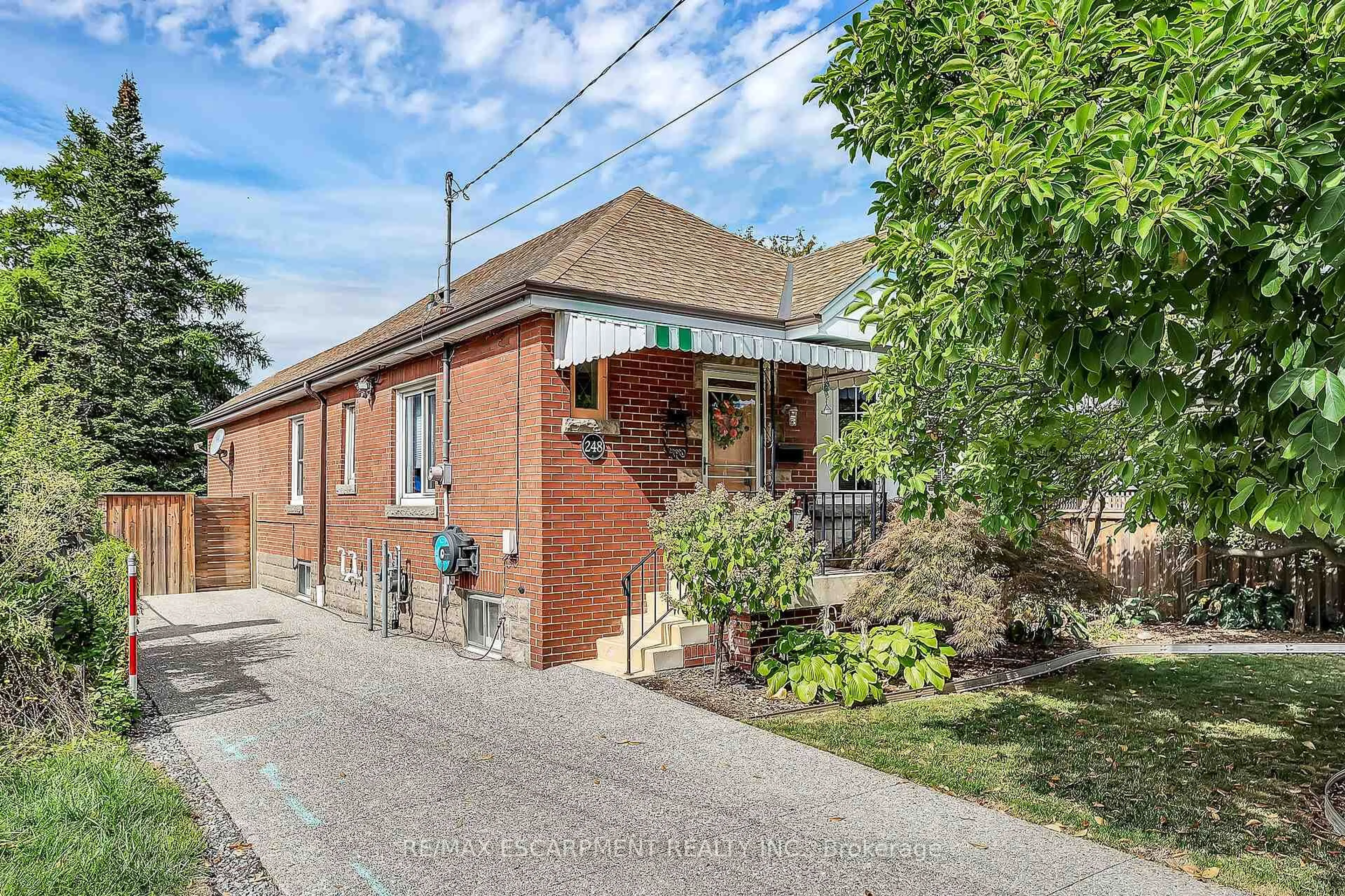 Home with brick exterior material, street for 248 East 12th St, Hamilton Ontario L9A 3X8