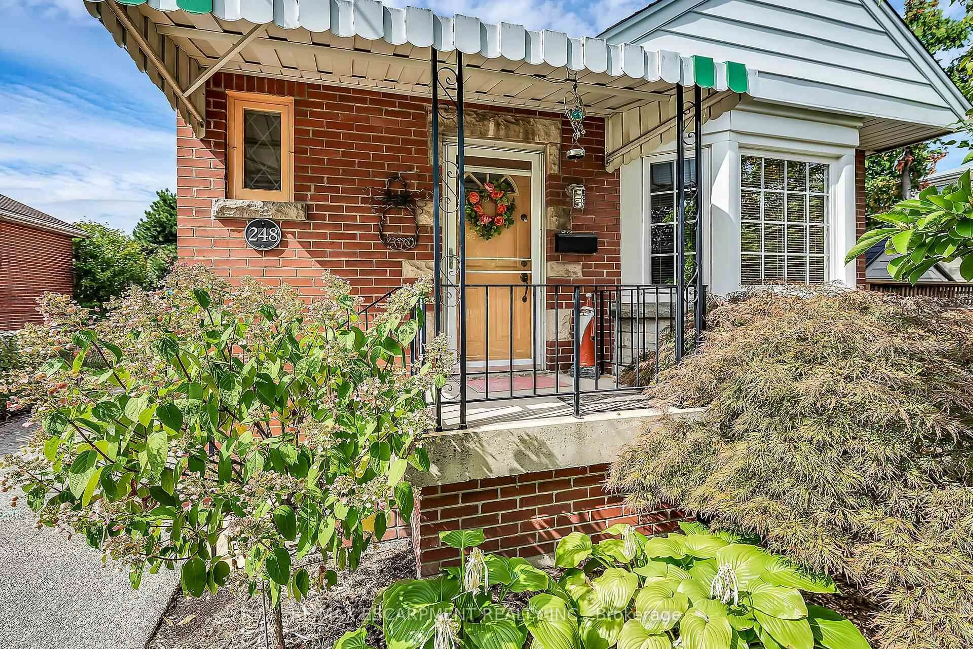 Home with brick exterior material, street for 248 East 12th St, Hamilton Ontario L9A 3X8