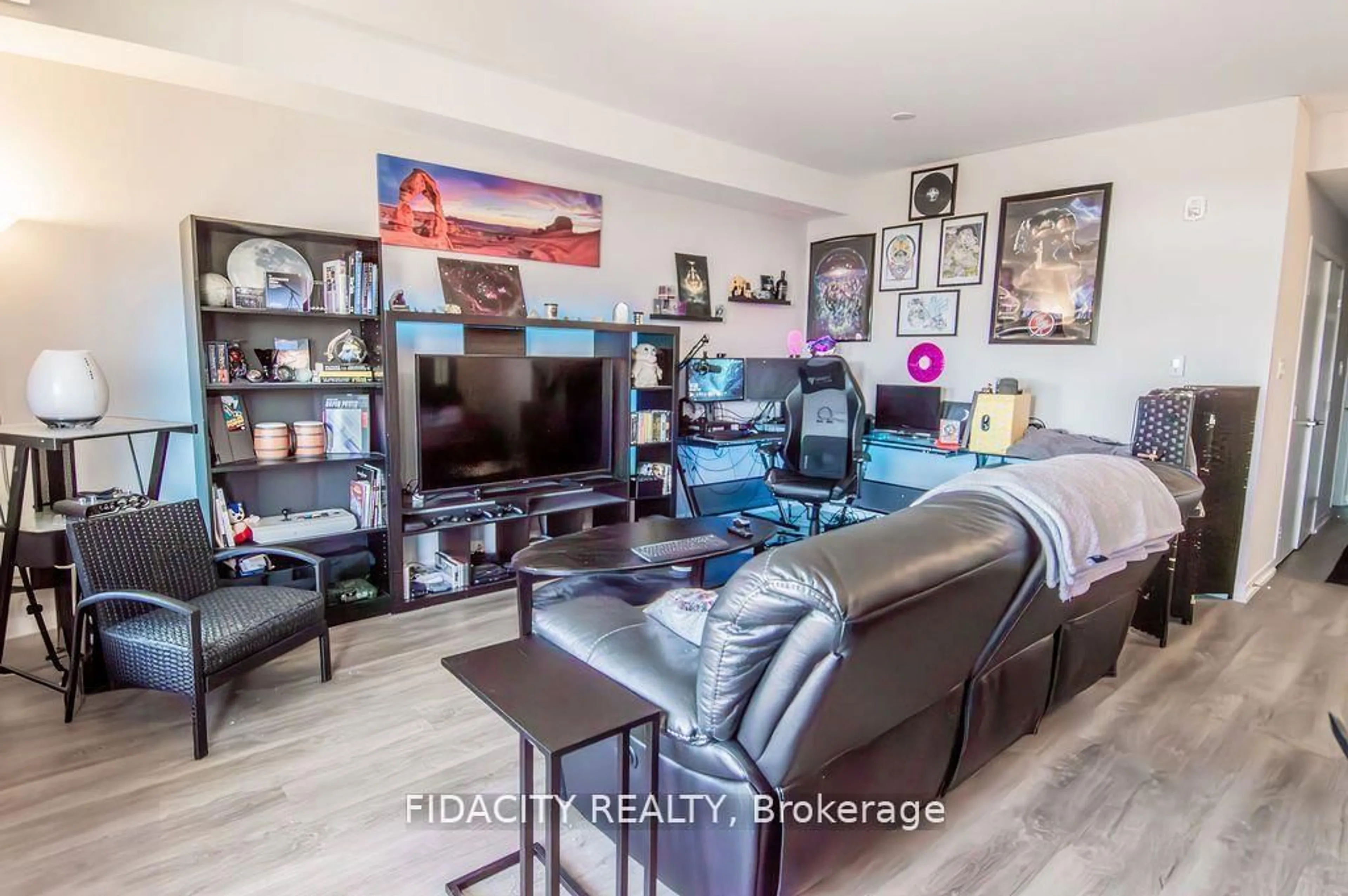 Living room with furniture, wood/laminate floor for 225 Citiplace Dr #H, Ottawa Ontario K2E 0A8