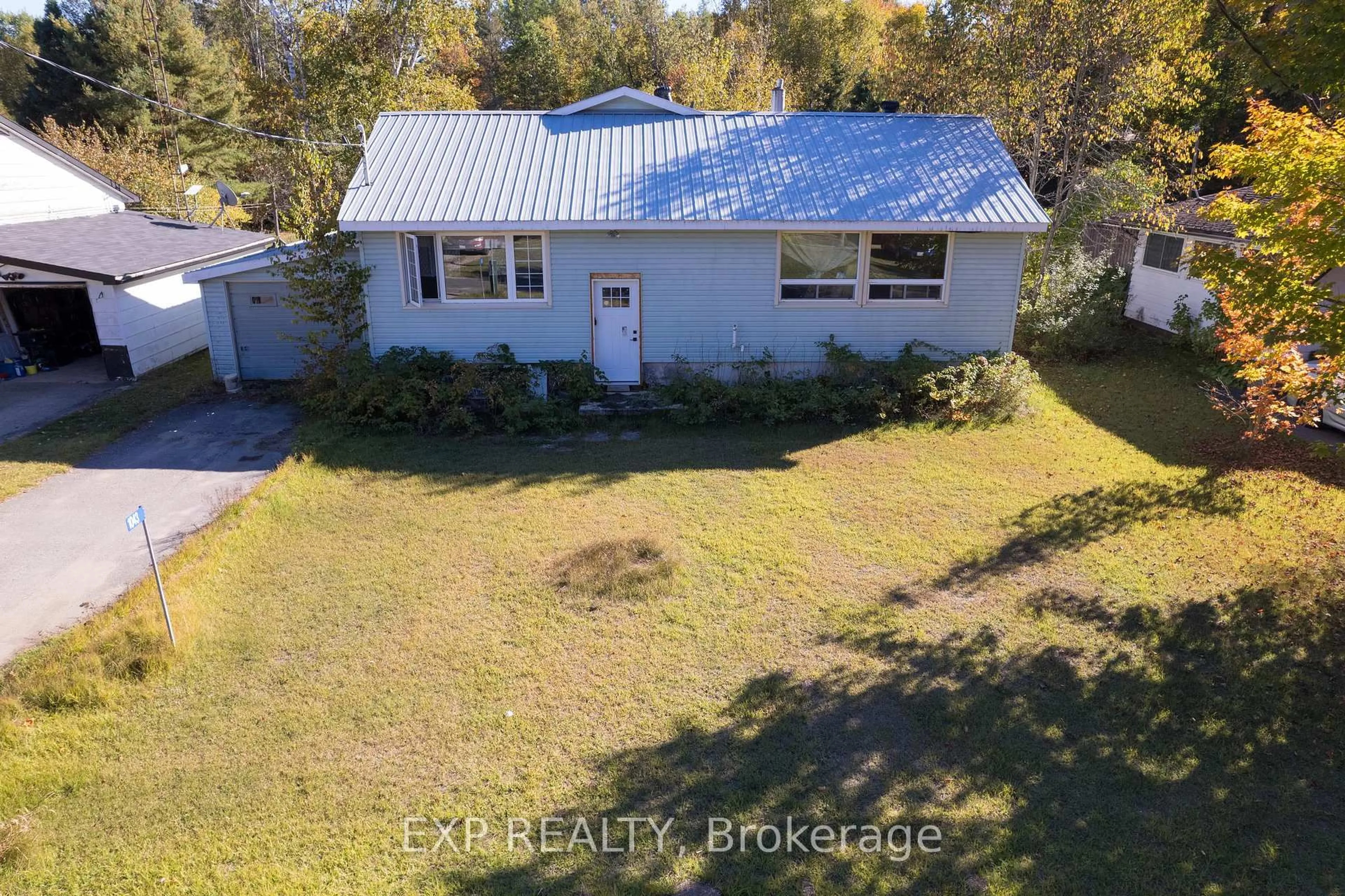 A pic from outside/outdoor area/front of a property/back of a property/a pic from drone, water/lake/river/ocean view for 1043 Estates Rd, Highlands East Ontario K0L 1C0