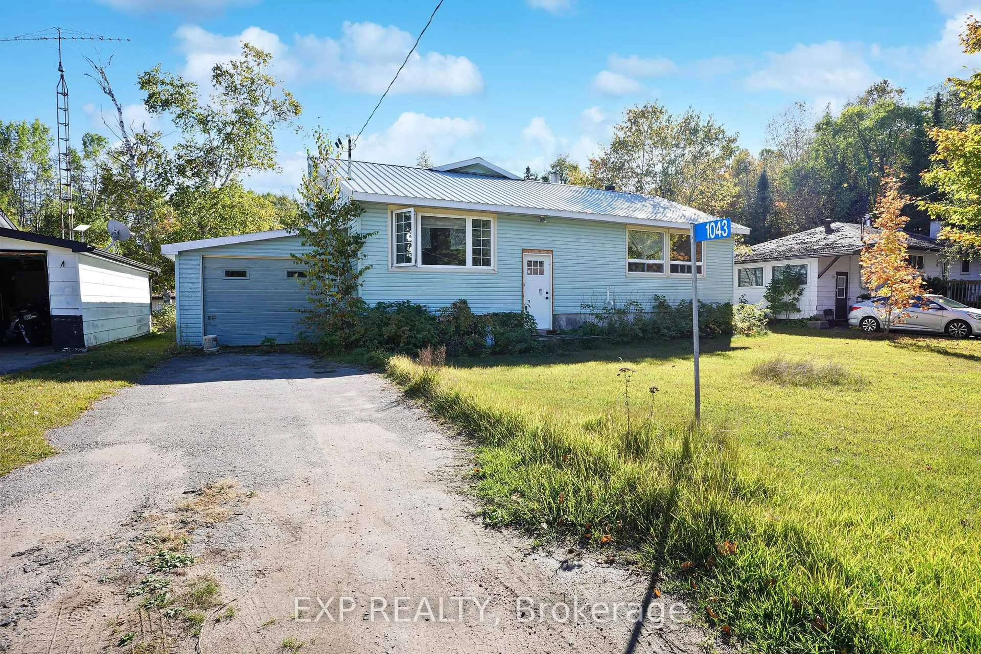 A pic from outside/outdoor area/front of a property/back of a property/a pic from drone, street for 1043 Estates Rd, Highlands East Ontario K0L 1C0