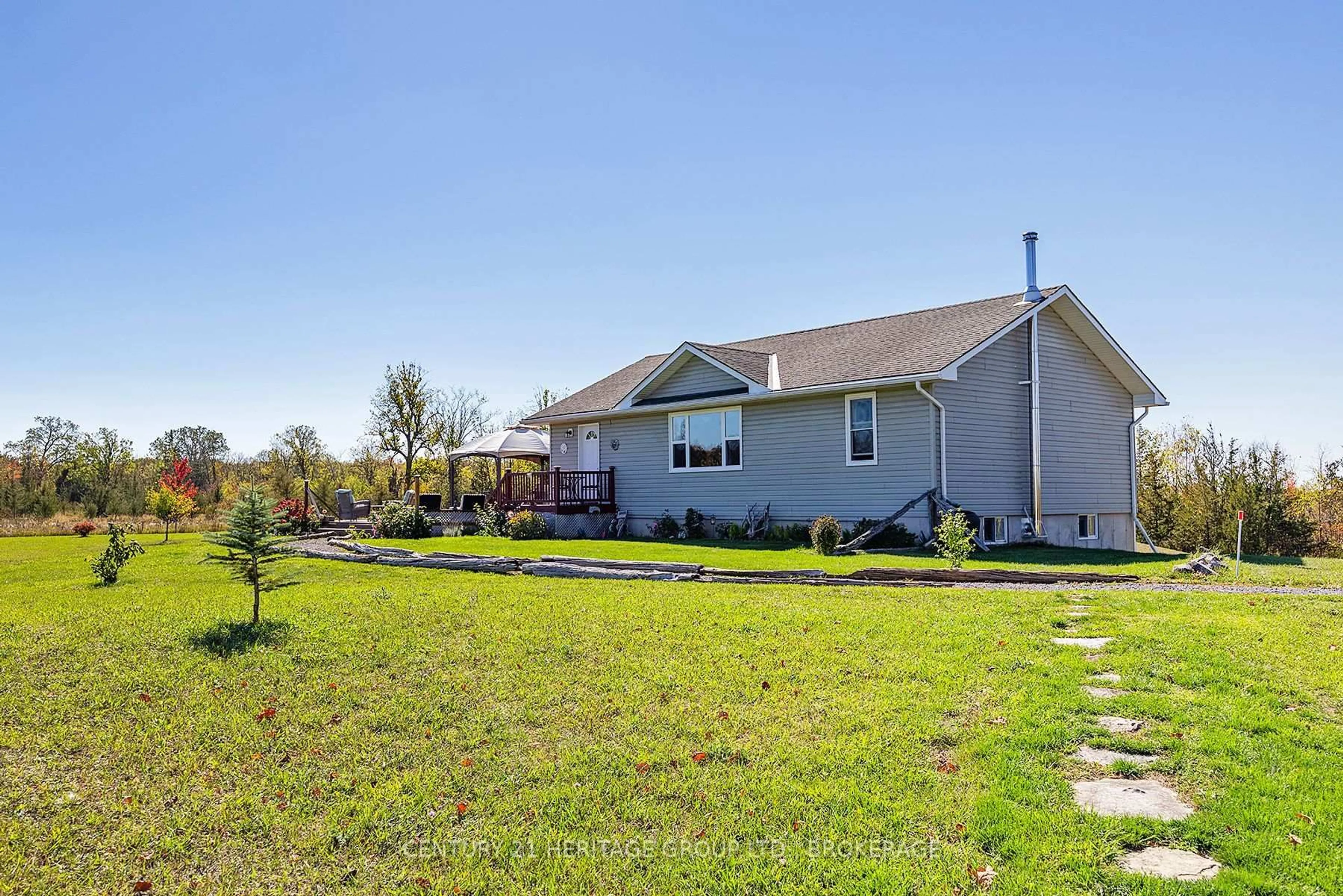 A pic from outside/outdoor area/front of a property/back of a property/a pic from drone, water/lake/river/ocean view for 920 Frizzell Rd, Tamworth Ontario K0K 3G0