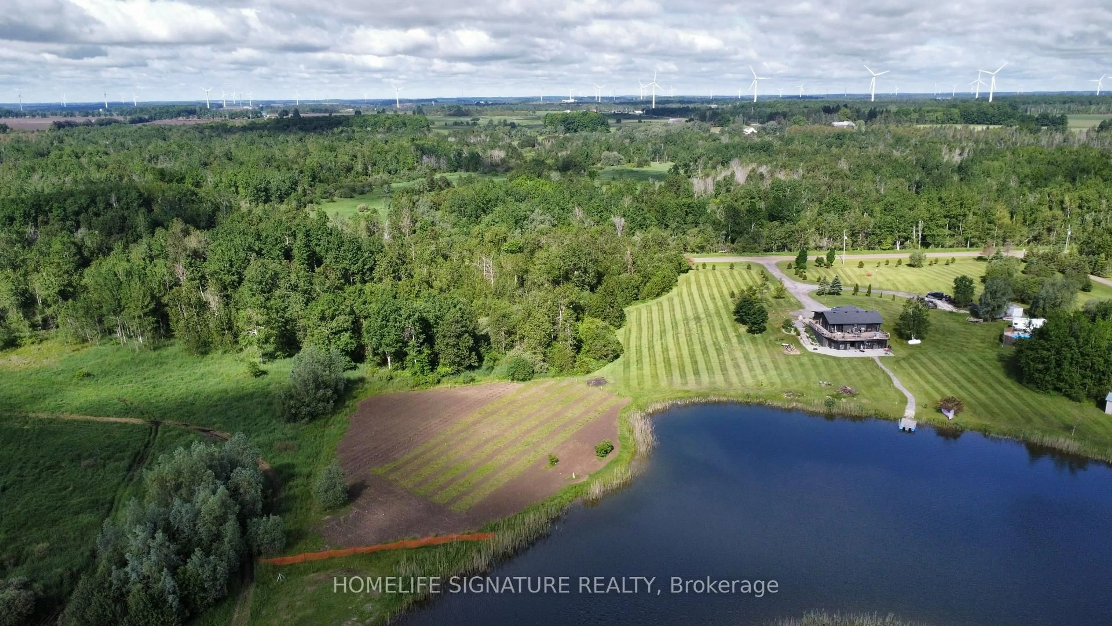 A pic from outside/outdoor area/front of a property/back of a property/a pic from drone, water/lake/river/ocean view for 375721 6th Line, Amaranth Ontario L0N 1S5