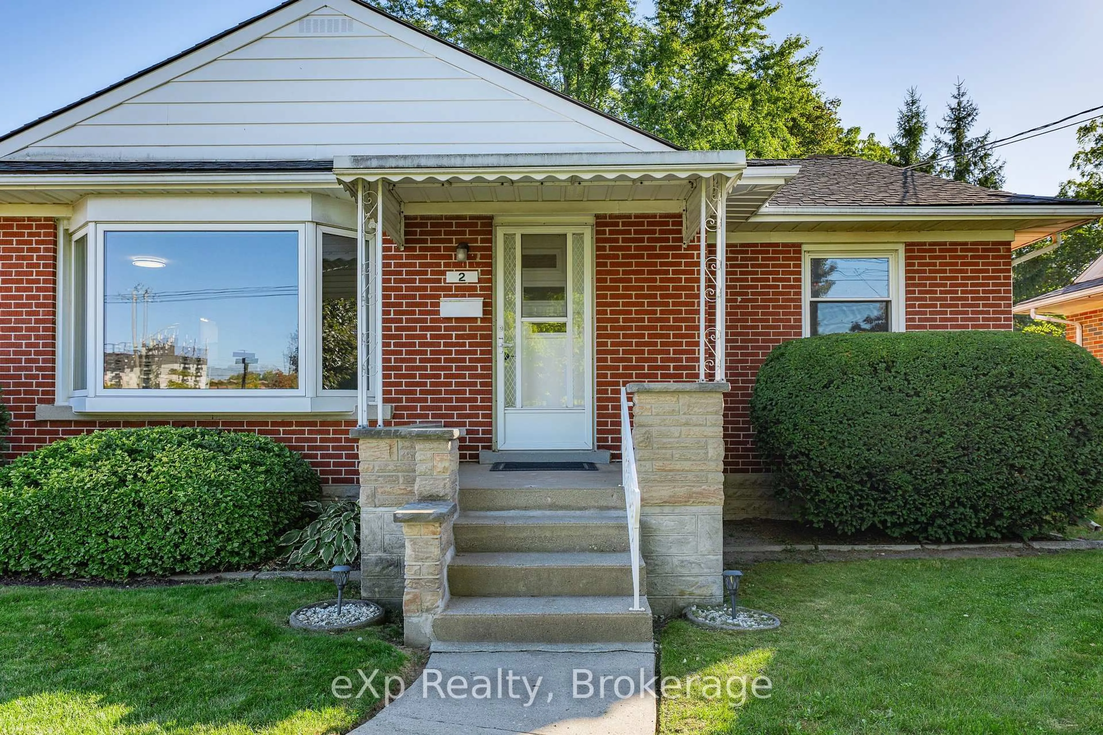 Home with brick exterior material, street for 2 Skov Cres, Guelph Ontario N1E 4B7