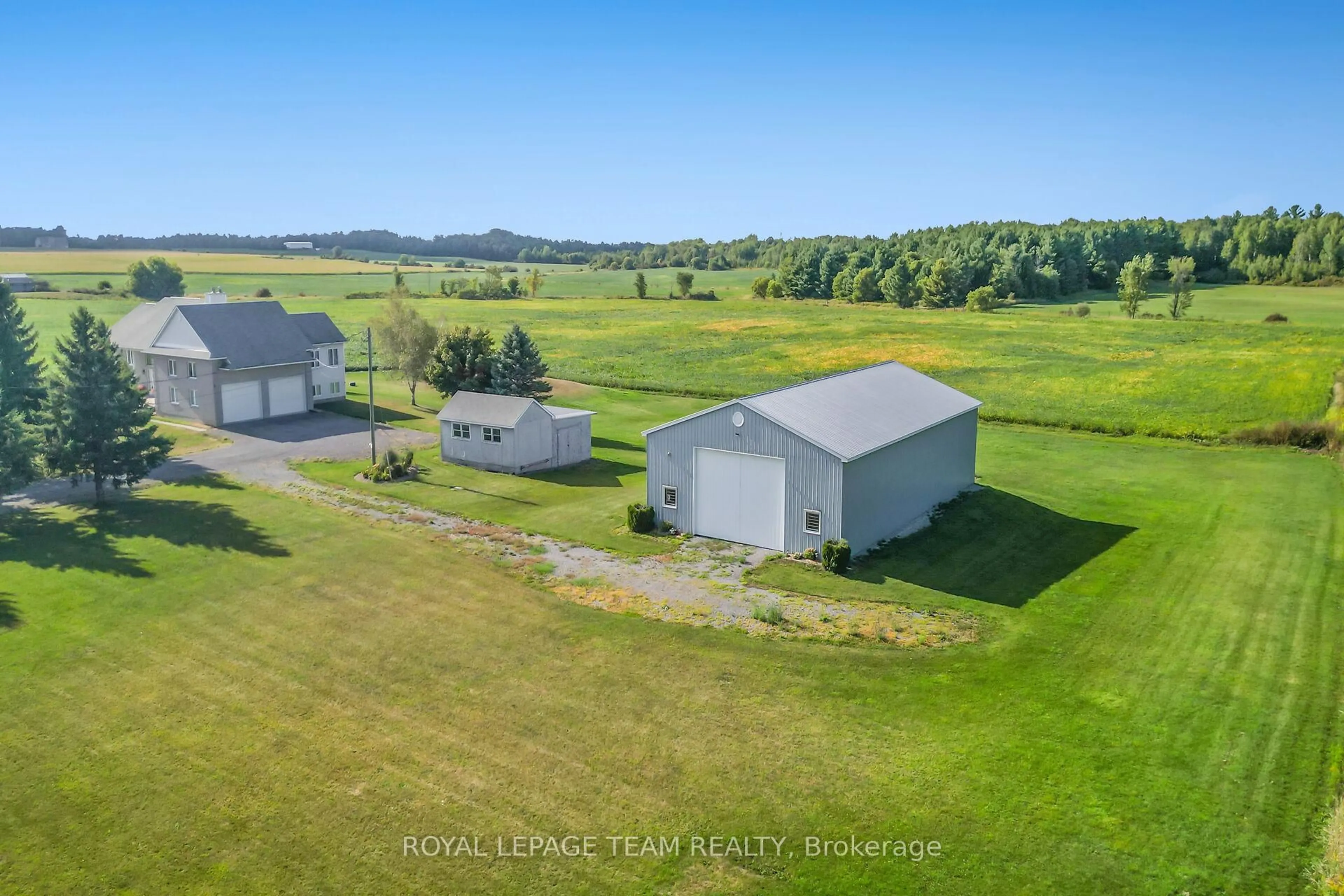 A pic from outside/outdoor area/front of a property/back of a property/a pic from drone, building for 8665 Russell Rd, Ottawa Ontario K4B 0J7