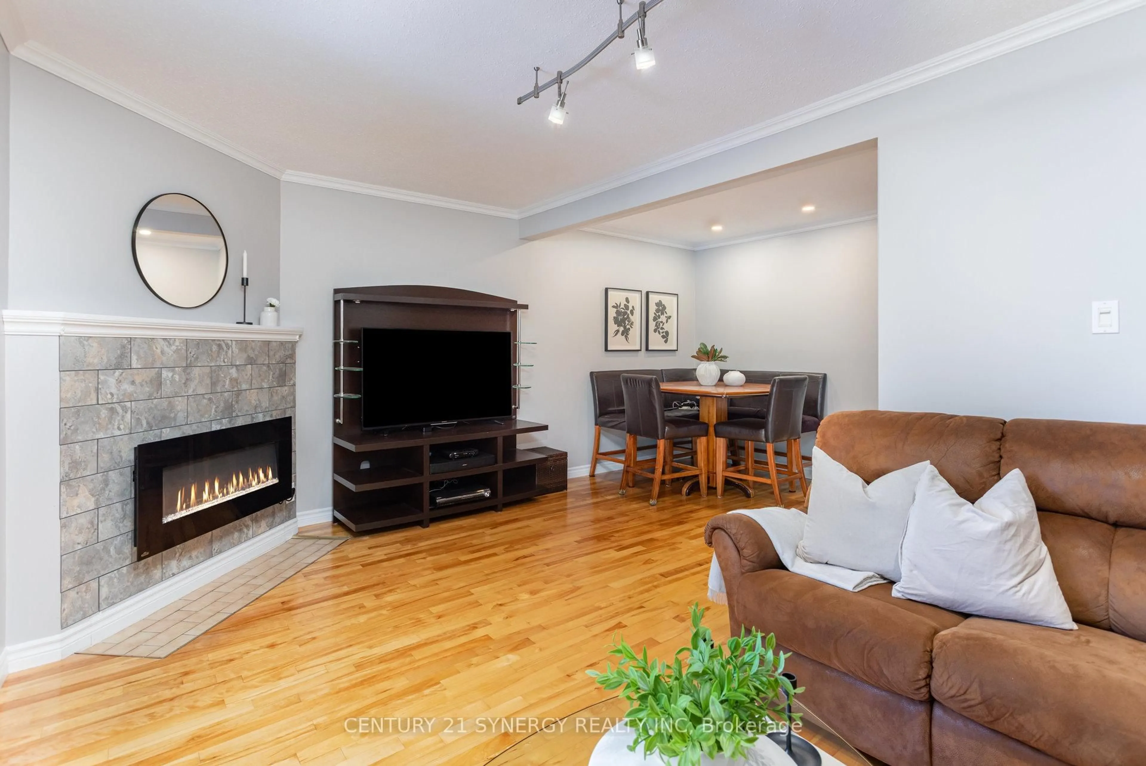 Living room with furniture, wood/laminate floor for 1574 Cheevers Cres #64, Ottawa Ontario K4A 2J9