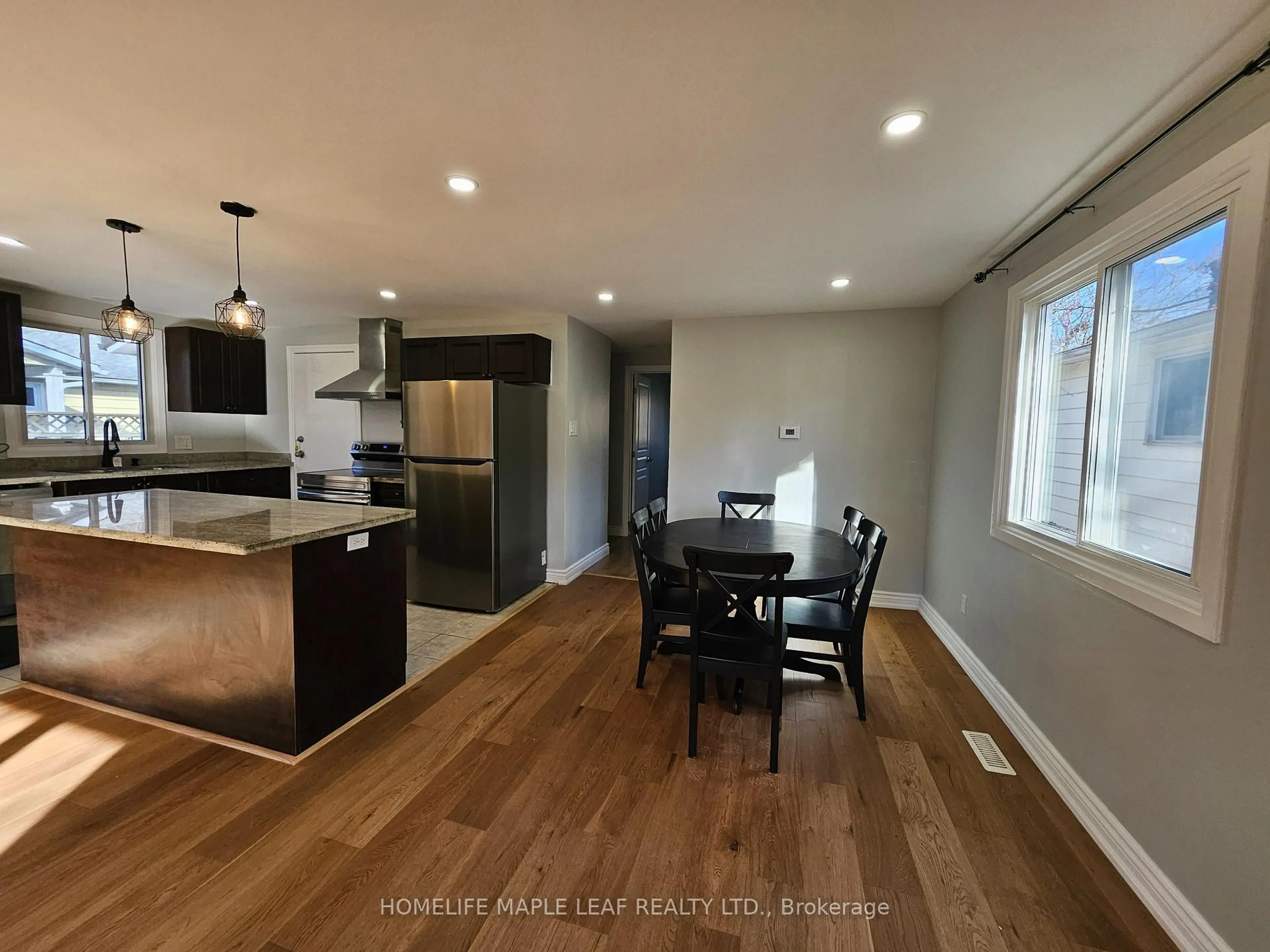 Open concept kitchen, wood/laminate floor for 56 Helene Cres, Waterloo Ontario N2L 5E5