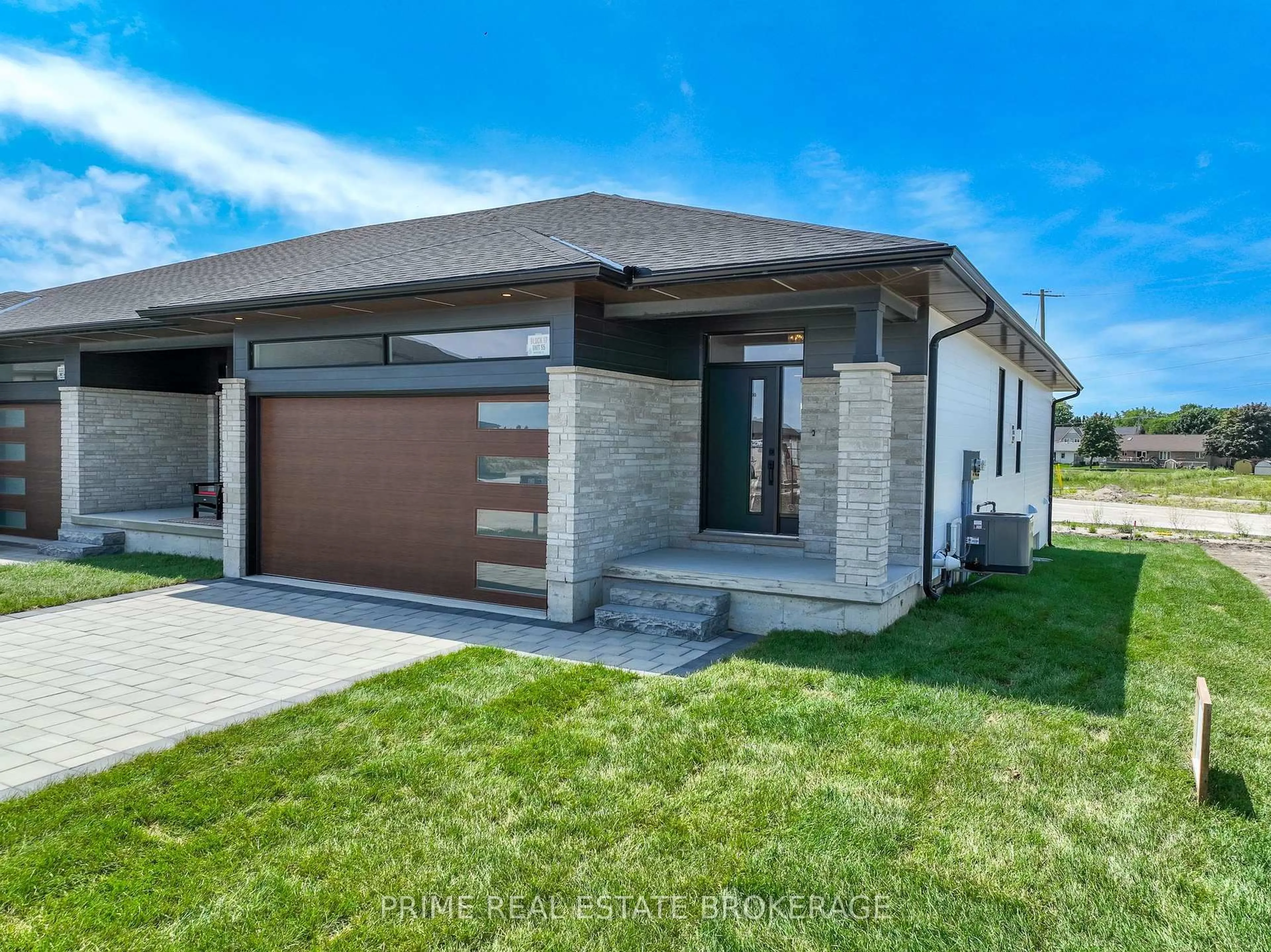 Home with brick exterior material, street for 2 Coastal Cres #55, Lambton Shores Ontario N0M 1T0