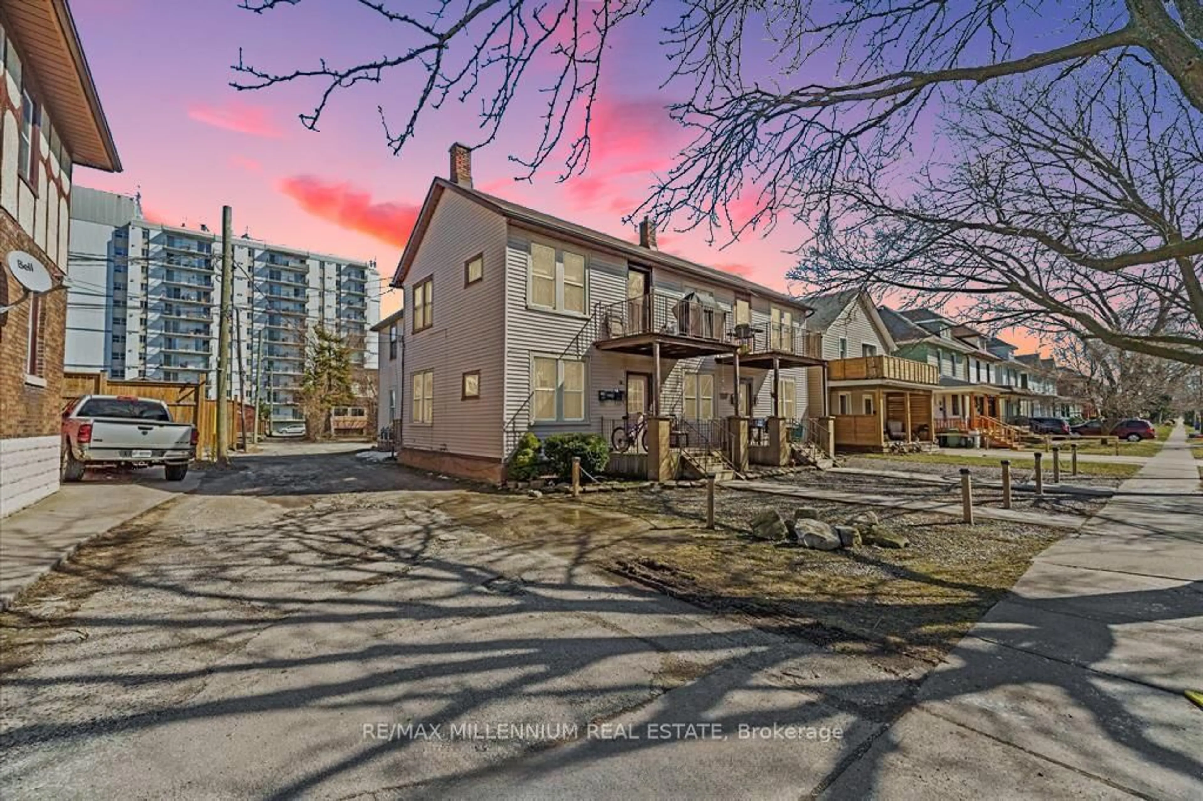 A pic from outside/outdoor area/front of a property/back of a property/a pic from drone, street for 124-130 Elm Ave, Windsor Ontario N9A 5G8