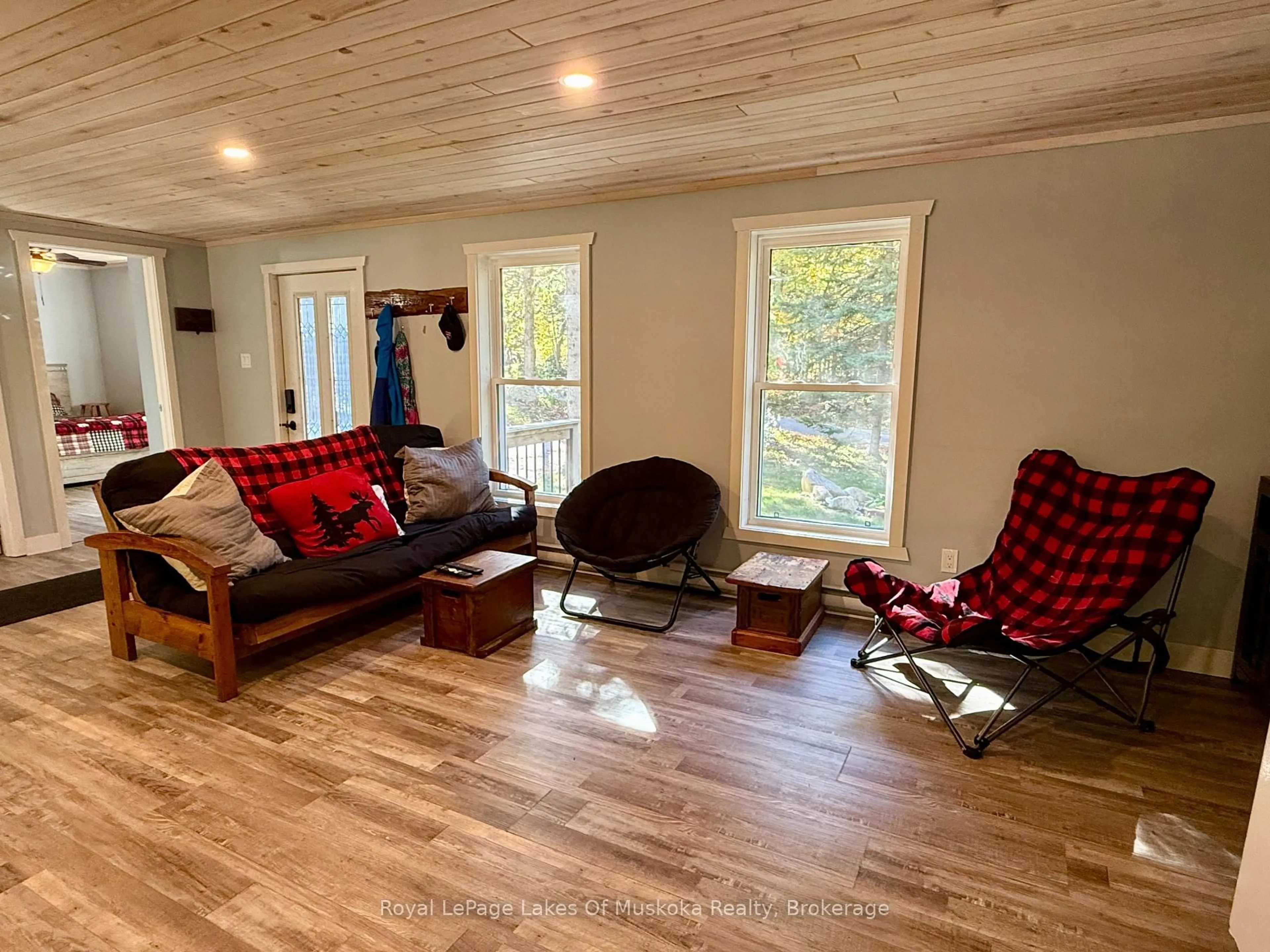 Living room with furniture, wood/laminate floor for 393 Doe Lake Rd, Armour Ontario P0A 1J0
