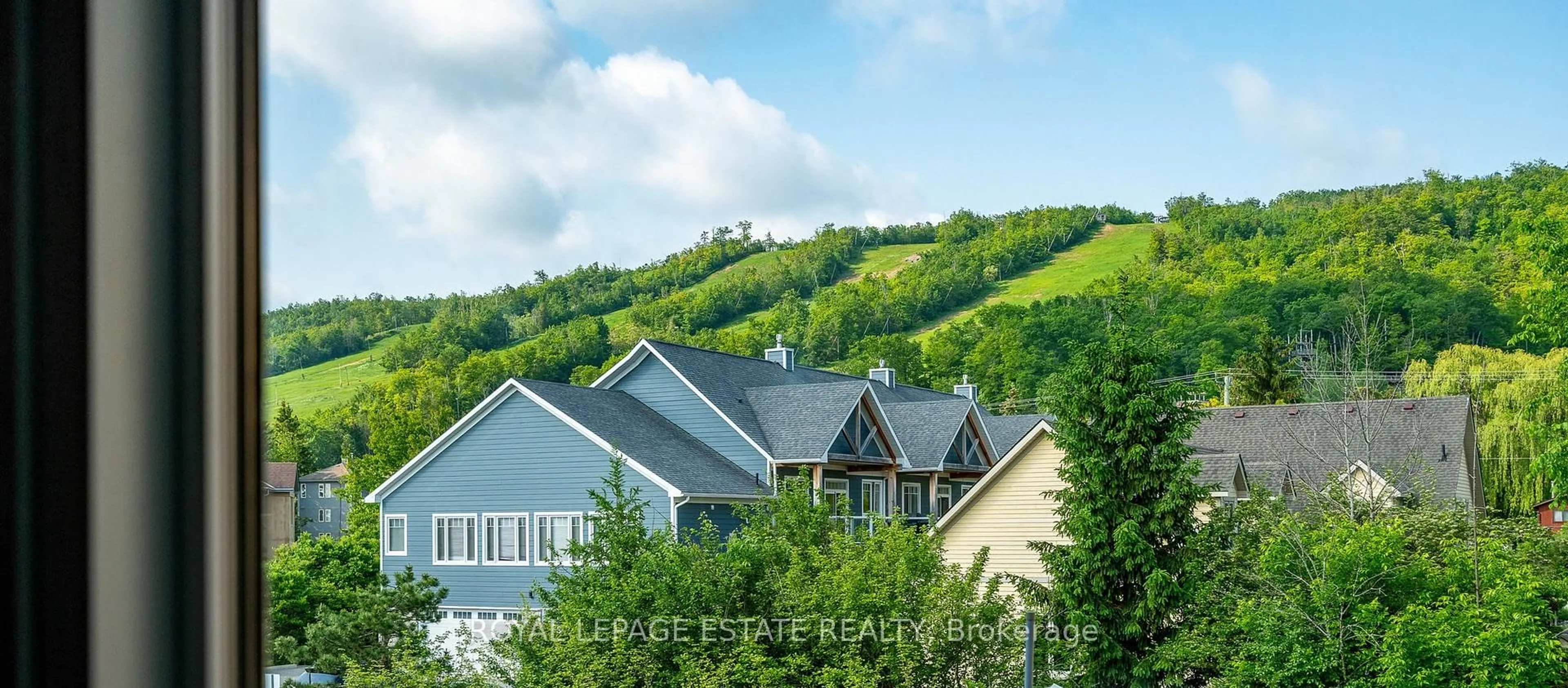 A pic from outside/outdoor area/front of a property/back of a property/a pic from drone, mountain view for 169 Jozo Weider Blvd #221, Blue Mountains Ontario L9Y 0P7