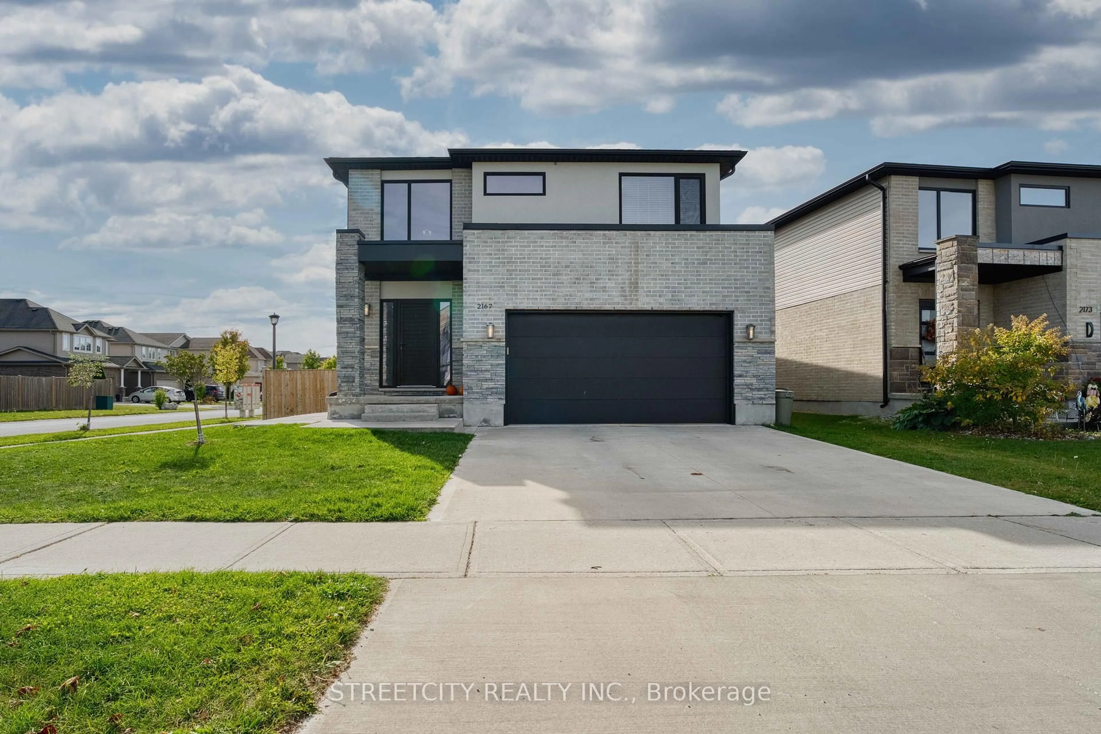 Home with brick exterior material, street for 2167 WATEROAK Dr, London North Ontario N6G 0P9