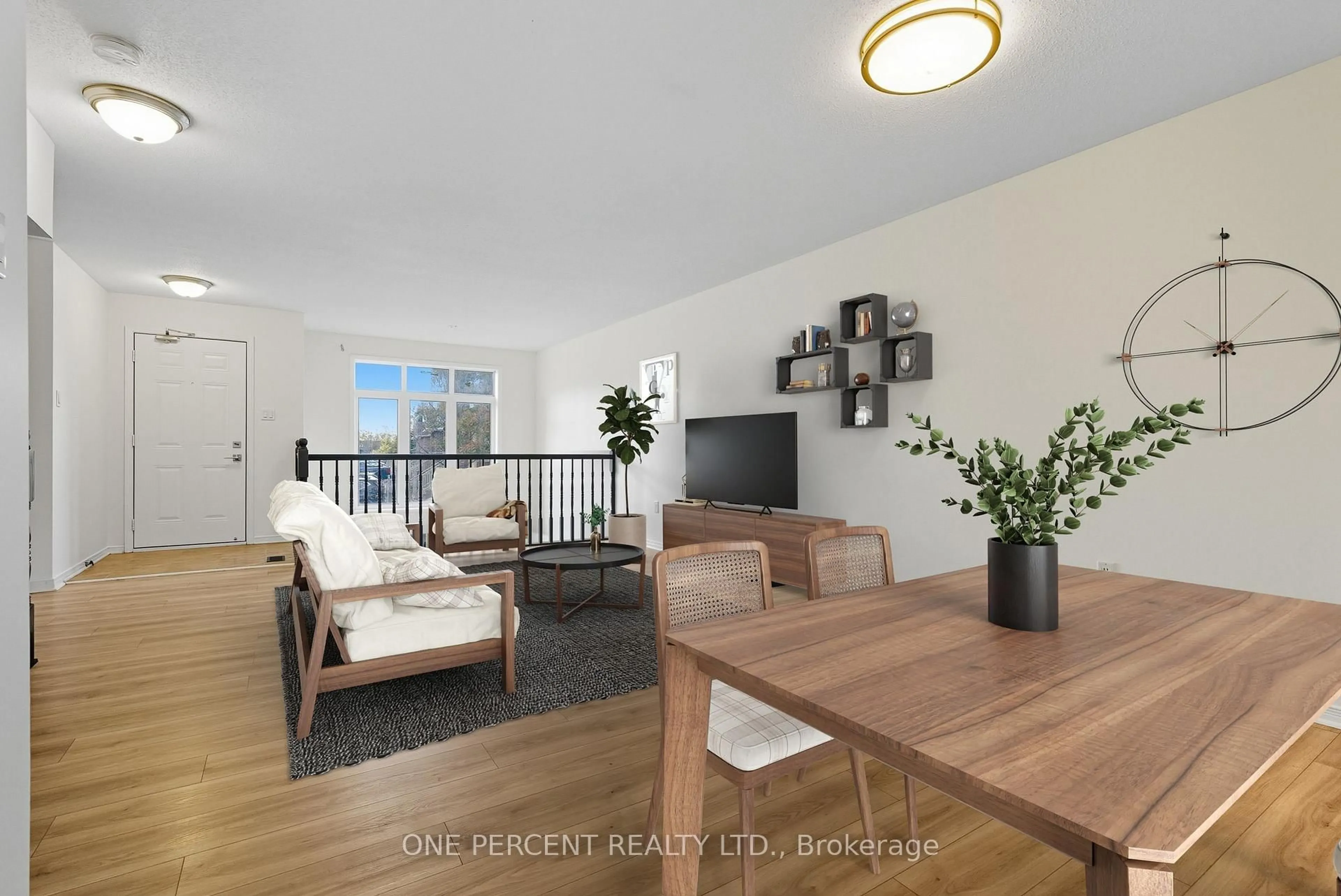 Living room with furniture, wood/laminate floor for 605 Reardon Private, Ottawa Ontario K1V 2K9