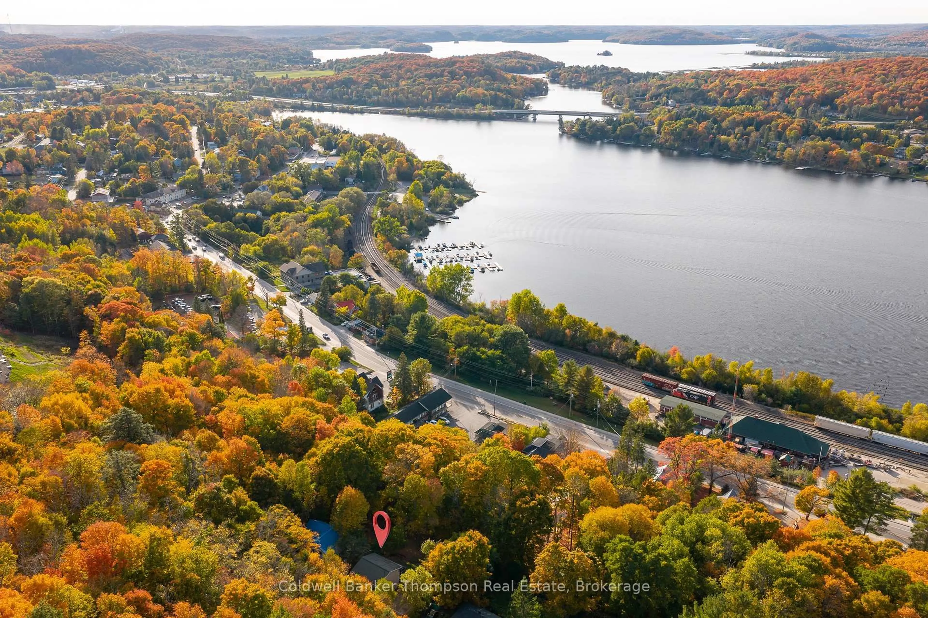 A pic from outside/outdoor area/front of a property/back of a property/a pic from drone, water/lake/river/ocean view for 16 Walpole St, Huntsville Ontario P1H 1V3