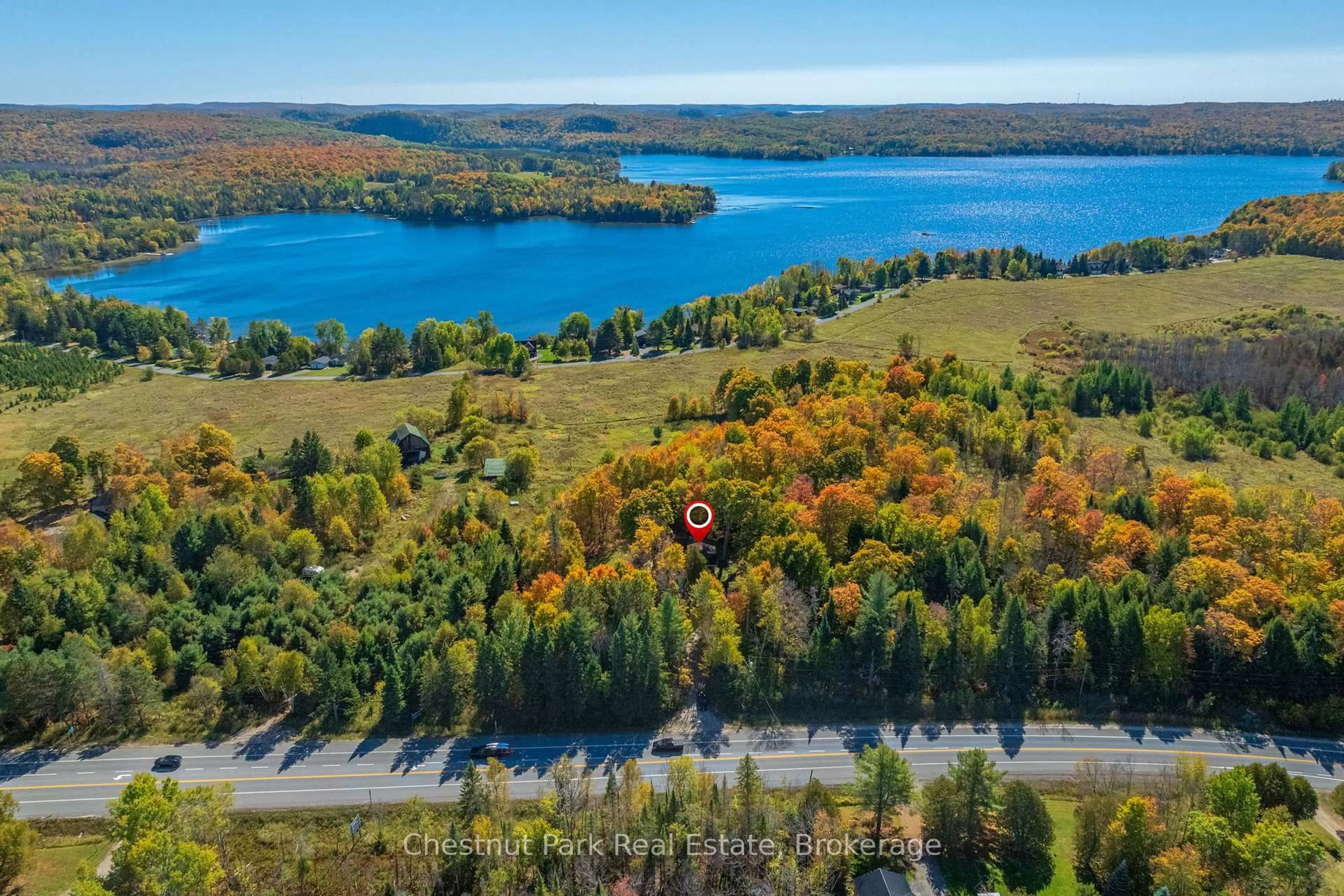 A pic from outside/outdoor area/front of a property/back of a property/a pic from drone, water/lake/river/ocean view for 2360 60 Highway, Lake of Bays Ontario P1H 2E5