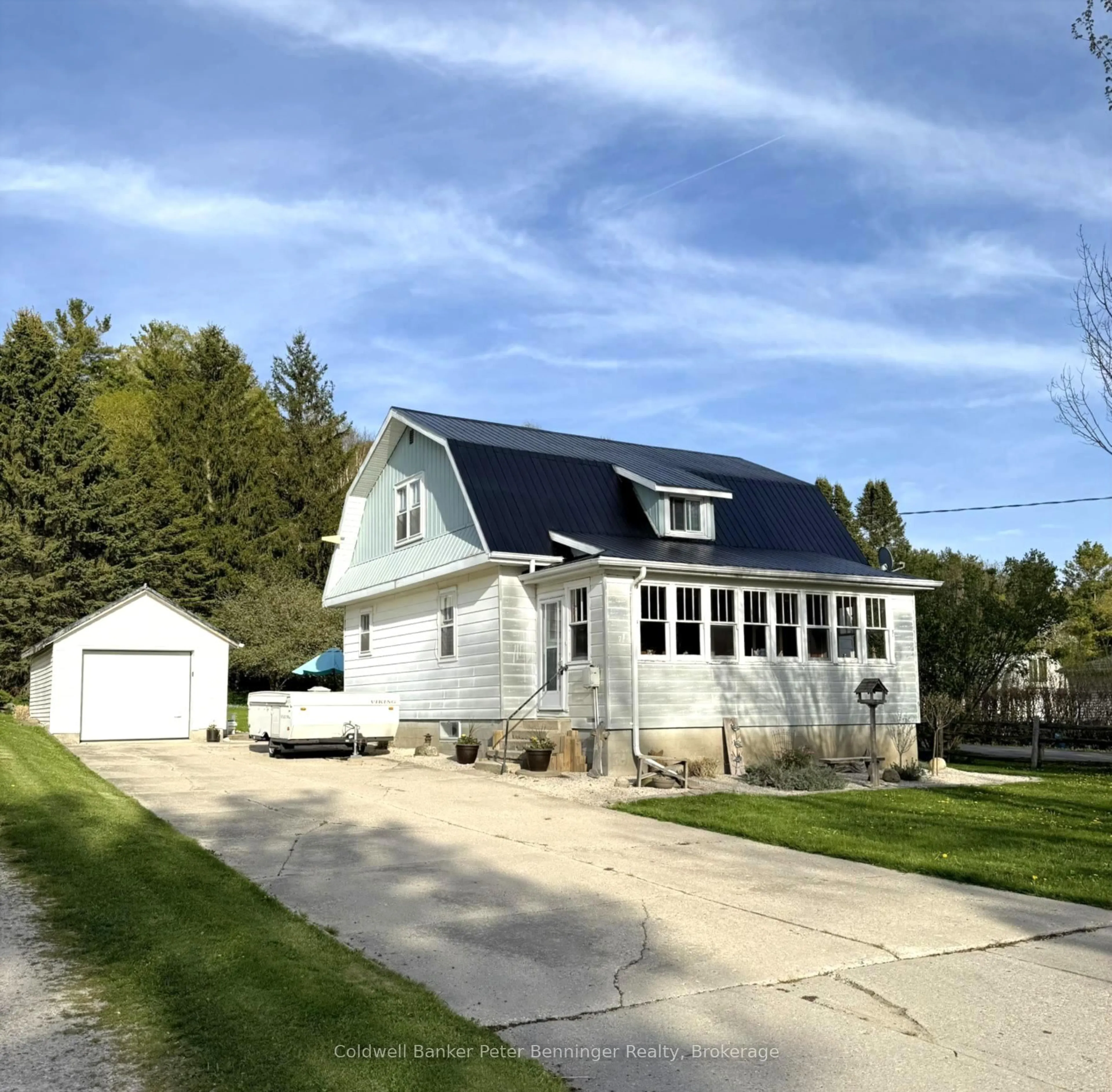 Home with vinyl exterior material, street for 1216 Bruce Road 12, South Bruce Ontario N0G 1W0
