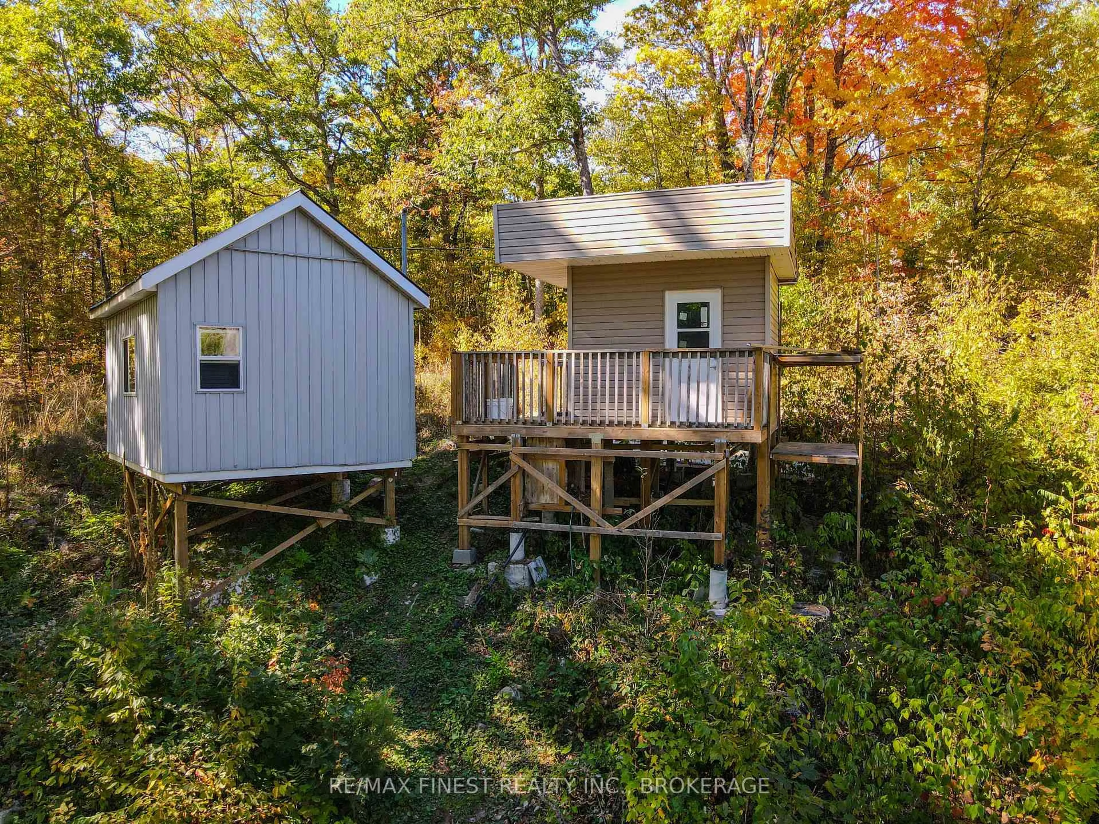 A pic from outside/outdoor area/front of a property/back of a property/a pic from drone, forest/trees view for 1097 Big Bay Dr, Arden Ontario K0H 1B0