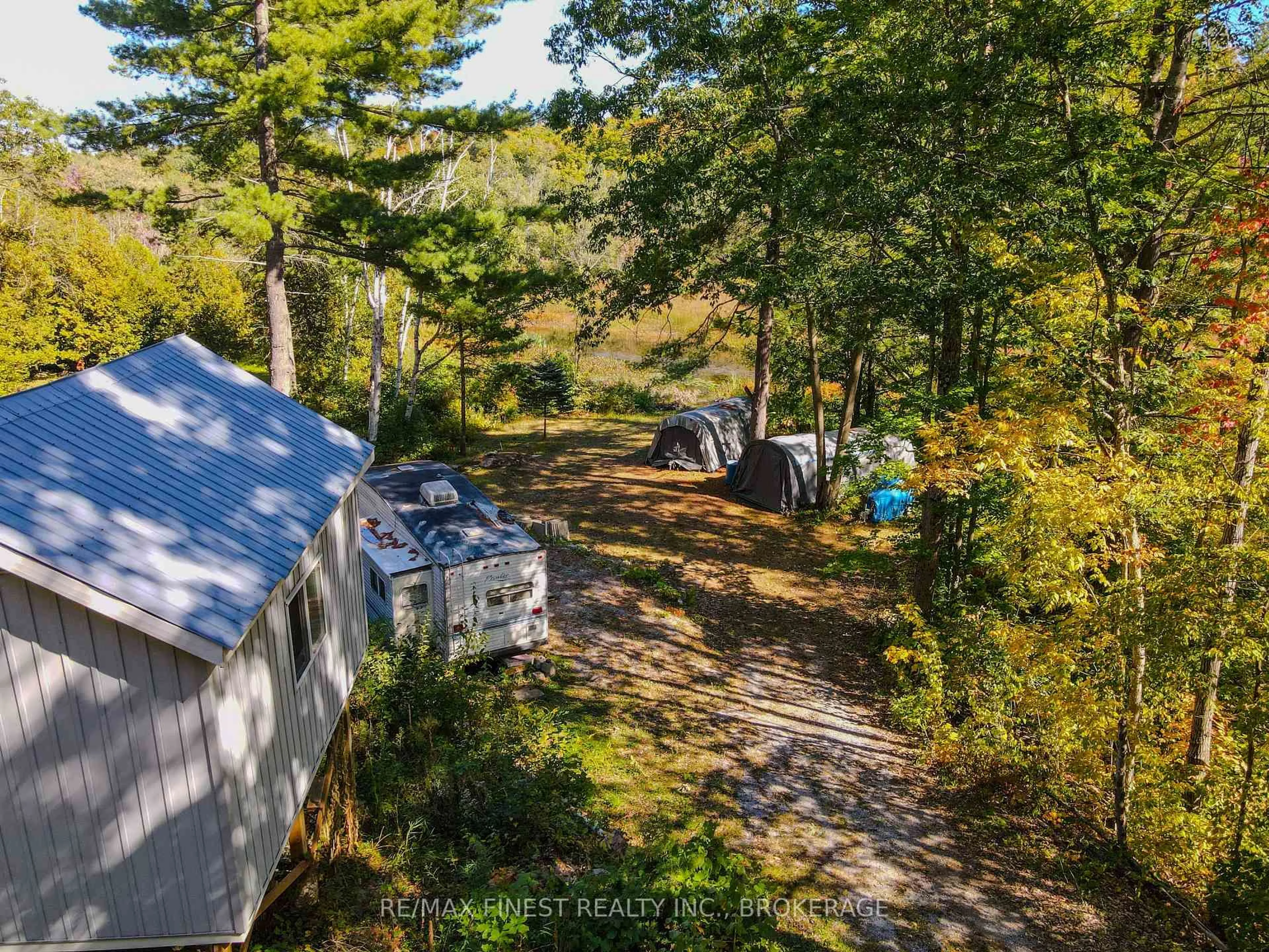 A pic from outside/outdoor area/front of a property/back of a property/a pic from drone, forest/trees view for 1097 Big Bay Dr, Arden Ontario K0H 1B0