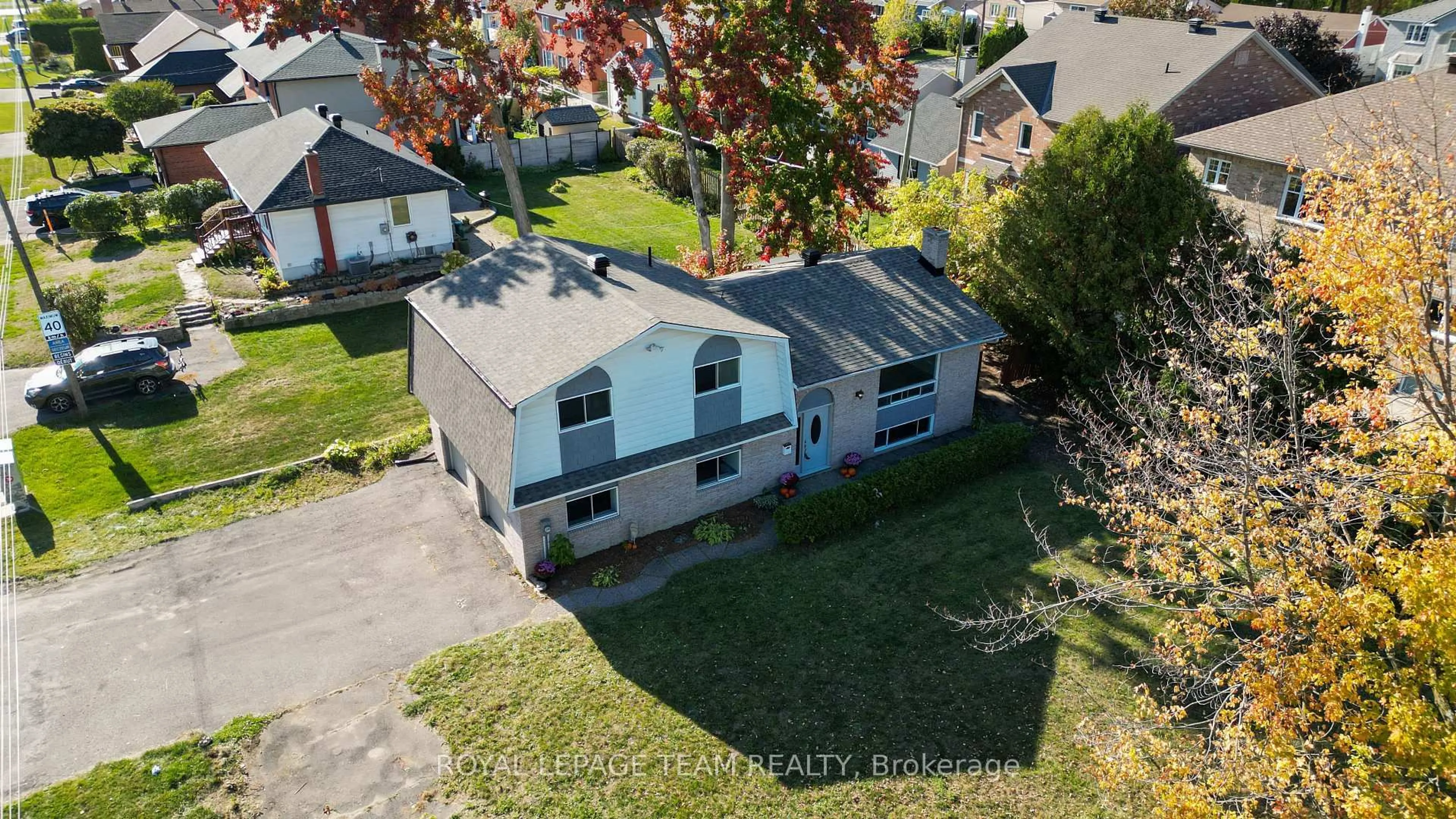 A pic from outside/outdoor area/front of a property/back of a property/a pic from drone, street for 1991 Kingsdale Ave, Ottawa Ontario K1T 1H9