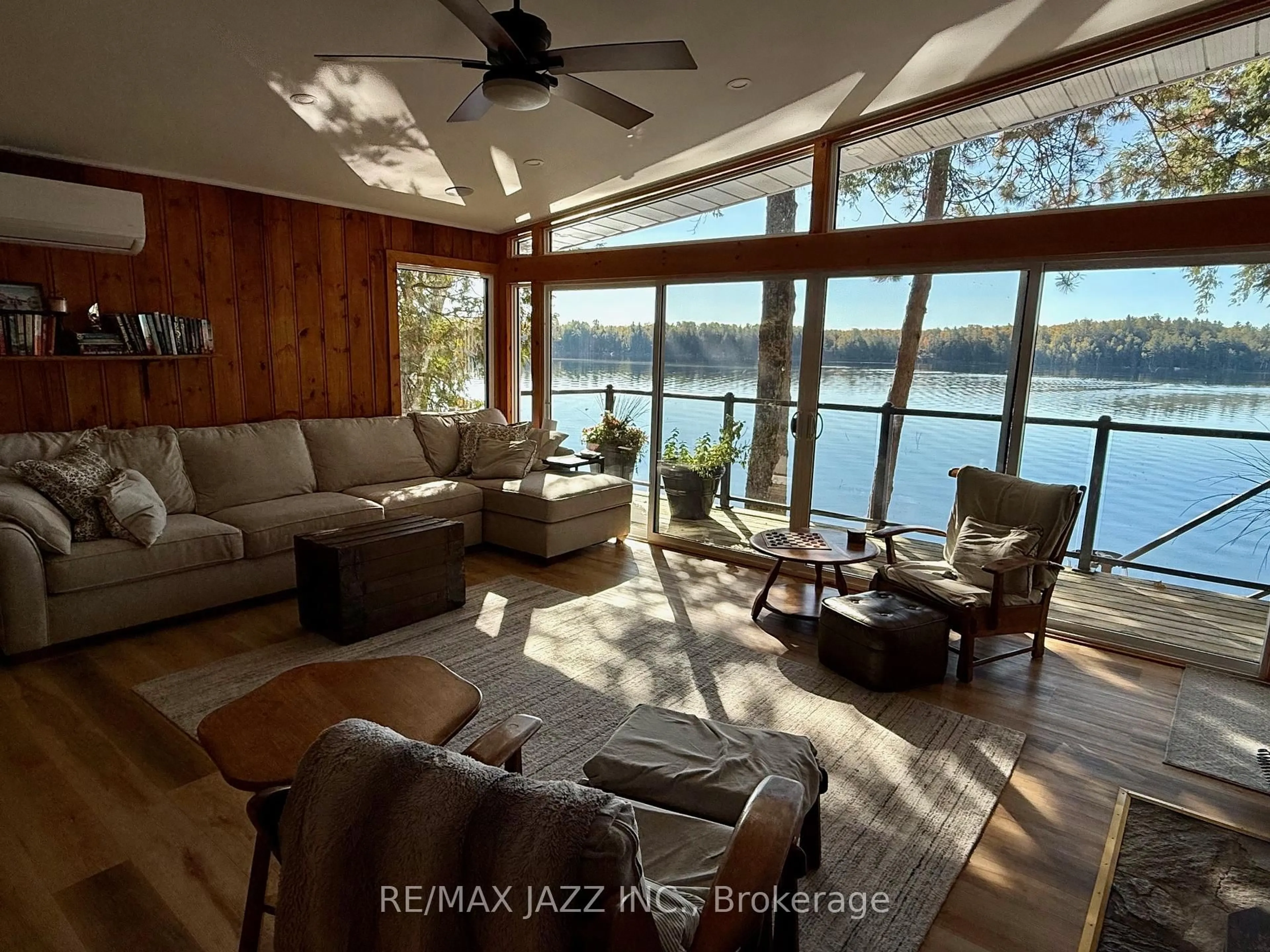 Living room with furniture, wood/laminate floor for 728 Renwick Rd, North Kawartha Ontario K0L 1A0