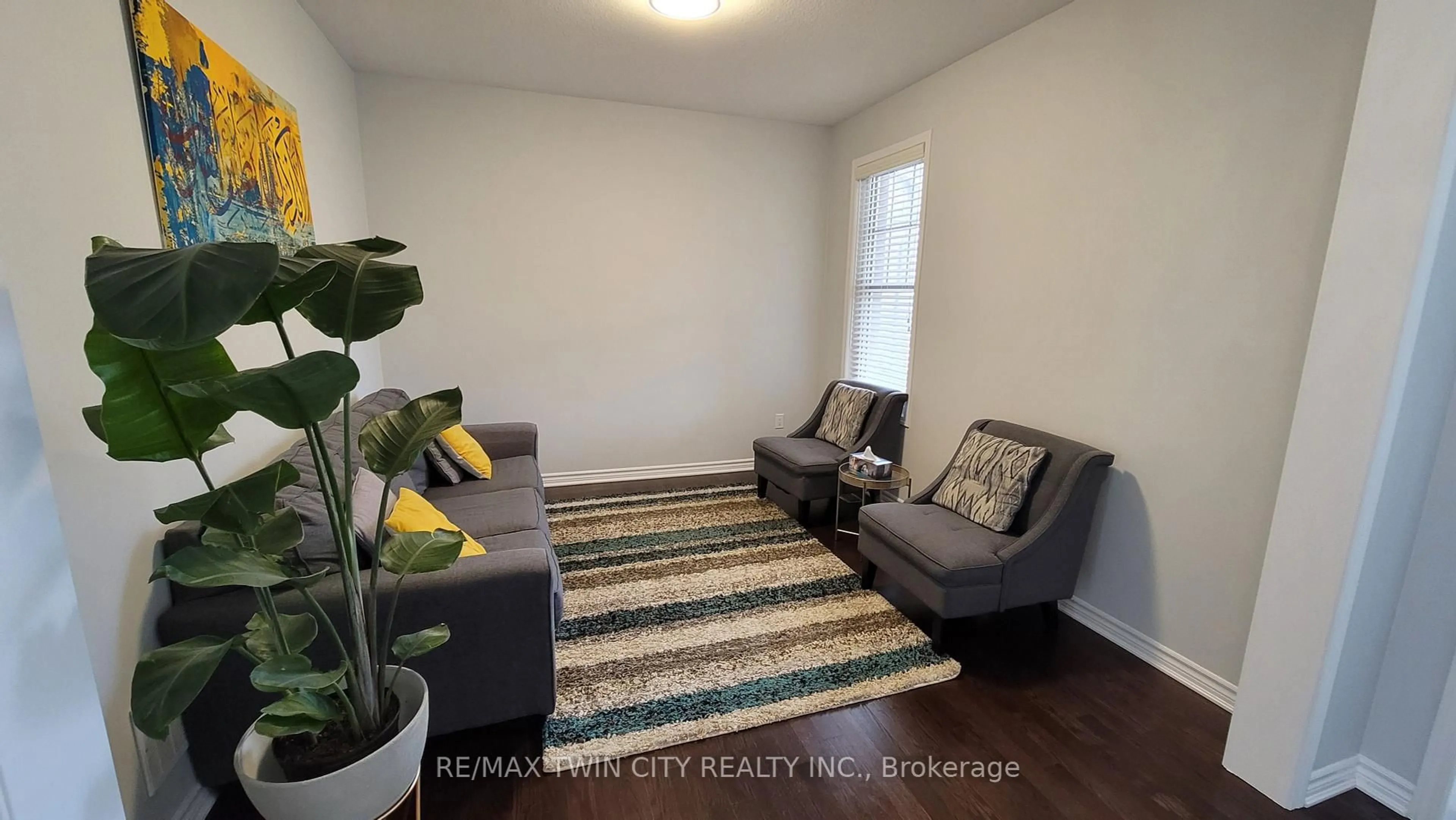 Living room with furniture, wood/laminate floor for 231 Grovehill Cres, Kitchener Ontario N2R 0K8