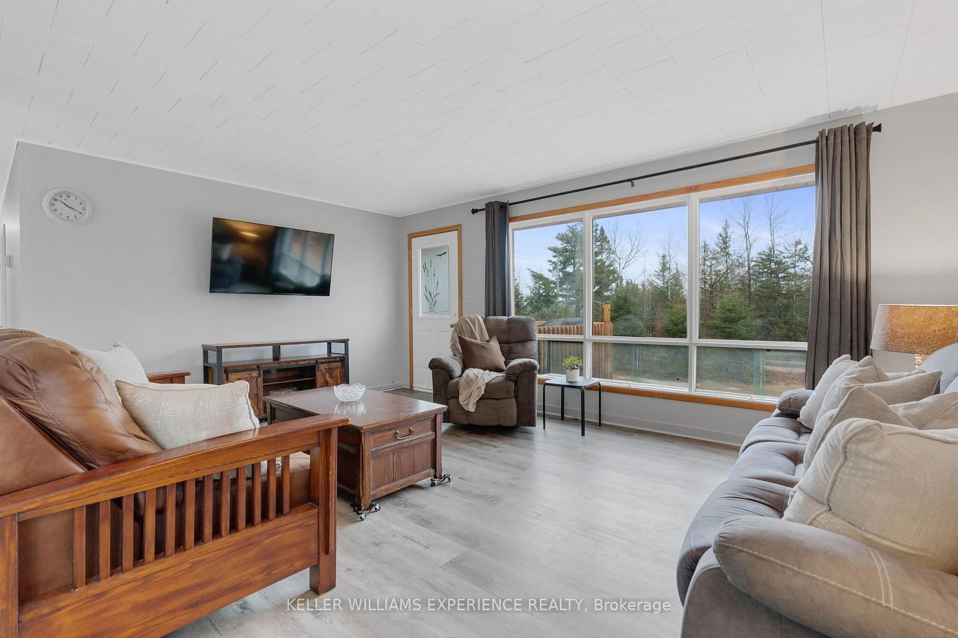 Living room with furniture, wood/laminate floor for 692 Forest Lake Rd, Joly Ontario P0A 1Z0