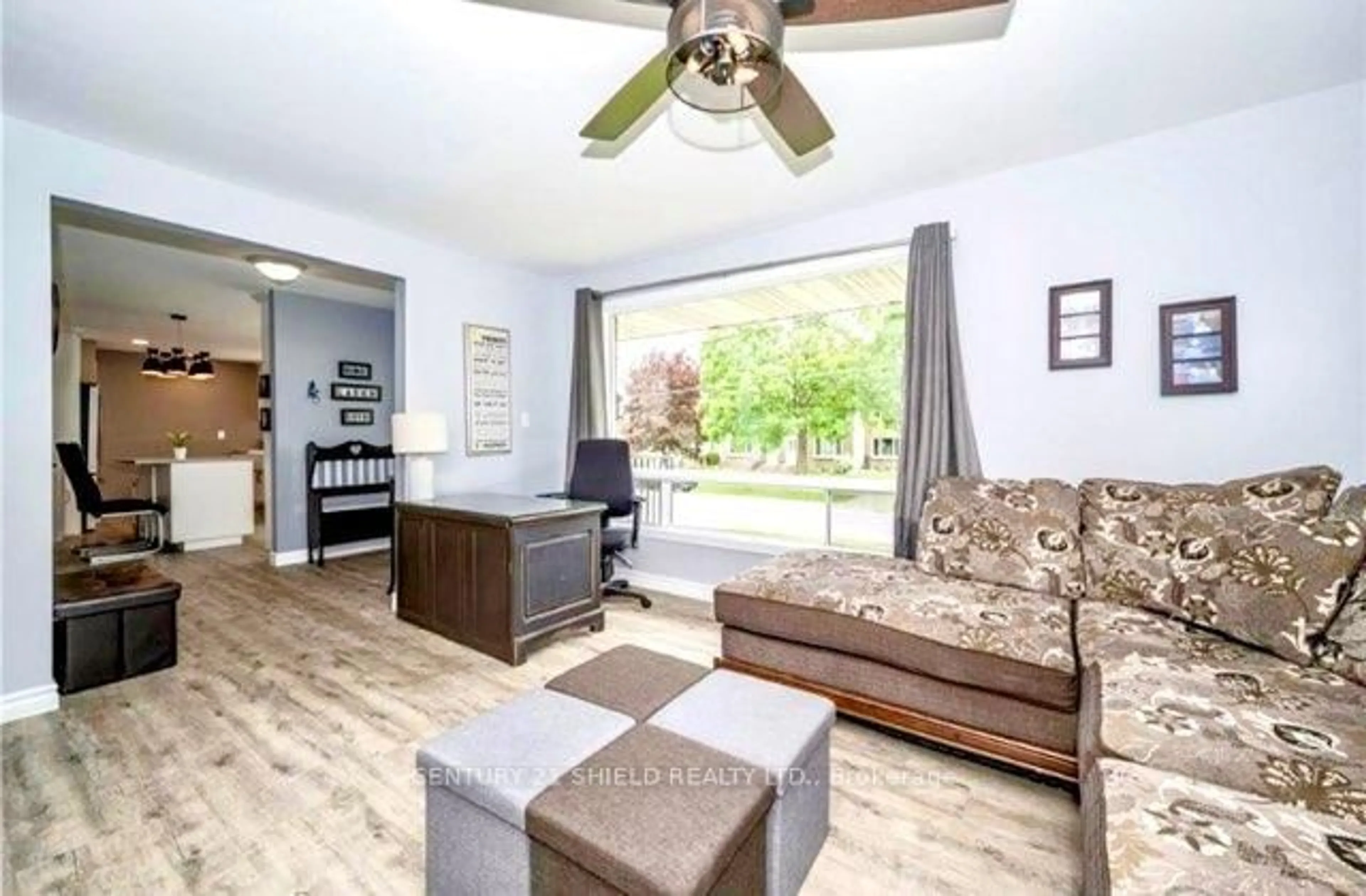 Living room with furniture, wood/laminate floor for 1336 Alfred St, Cornwall Ontario K6J 4Z8