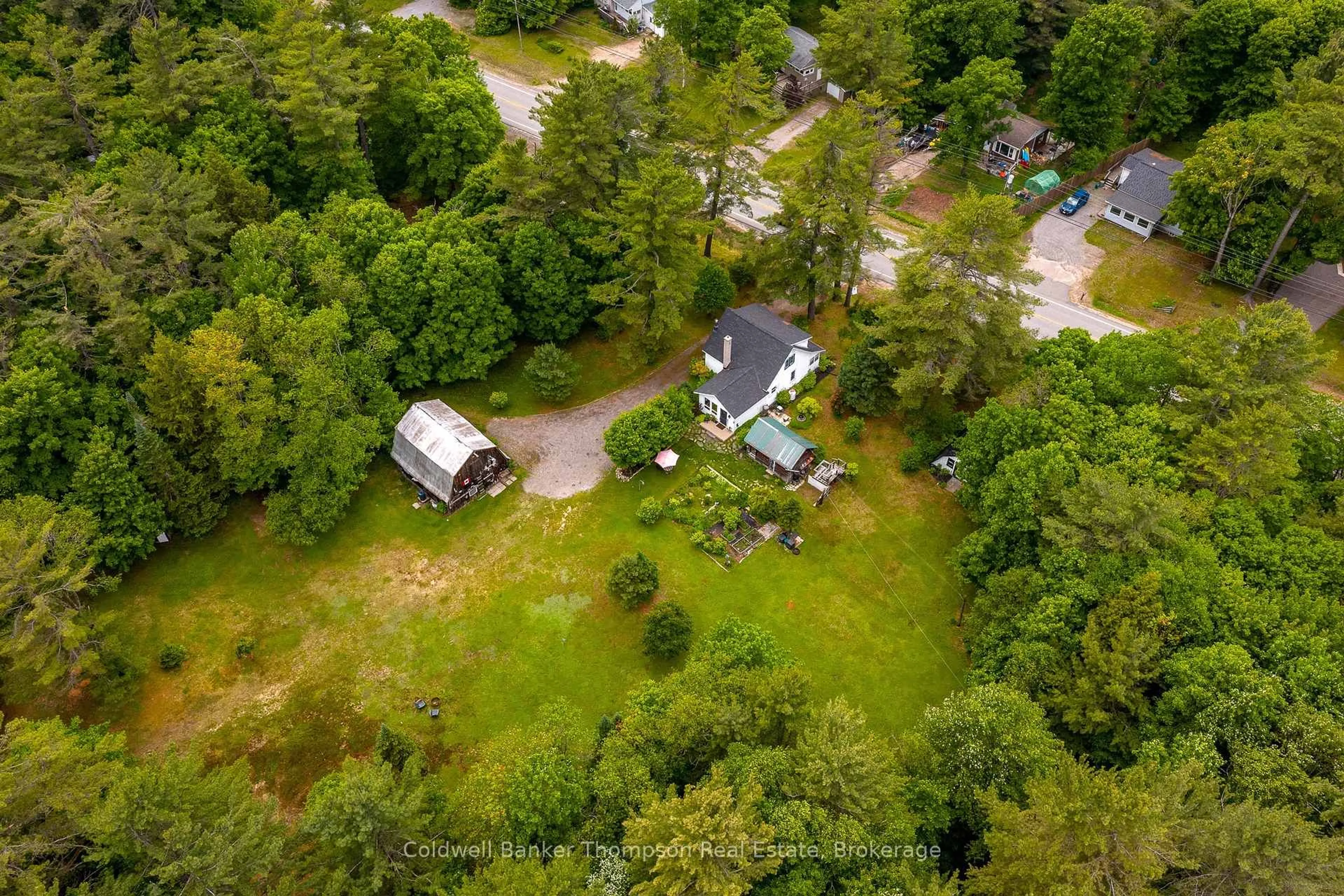 A pic from outside/outdoor area/front of a property/back of a property/a pic from drone, forest/trees view for 623 141 Highway, Huntsville Ontario P0B 1M0