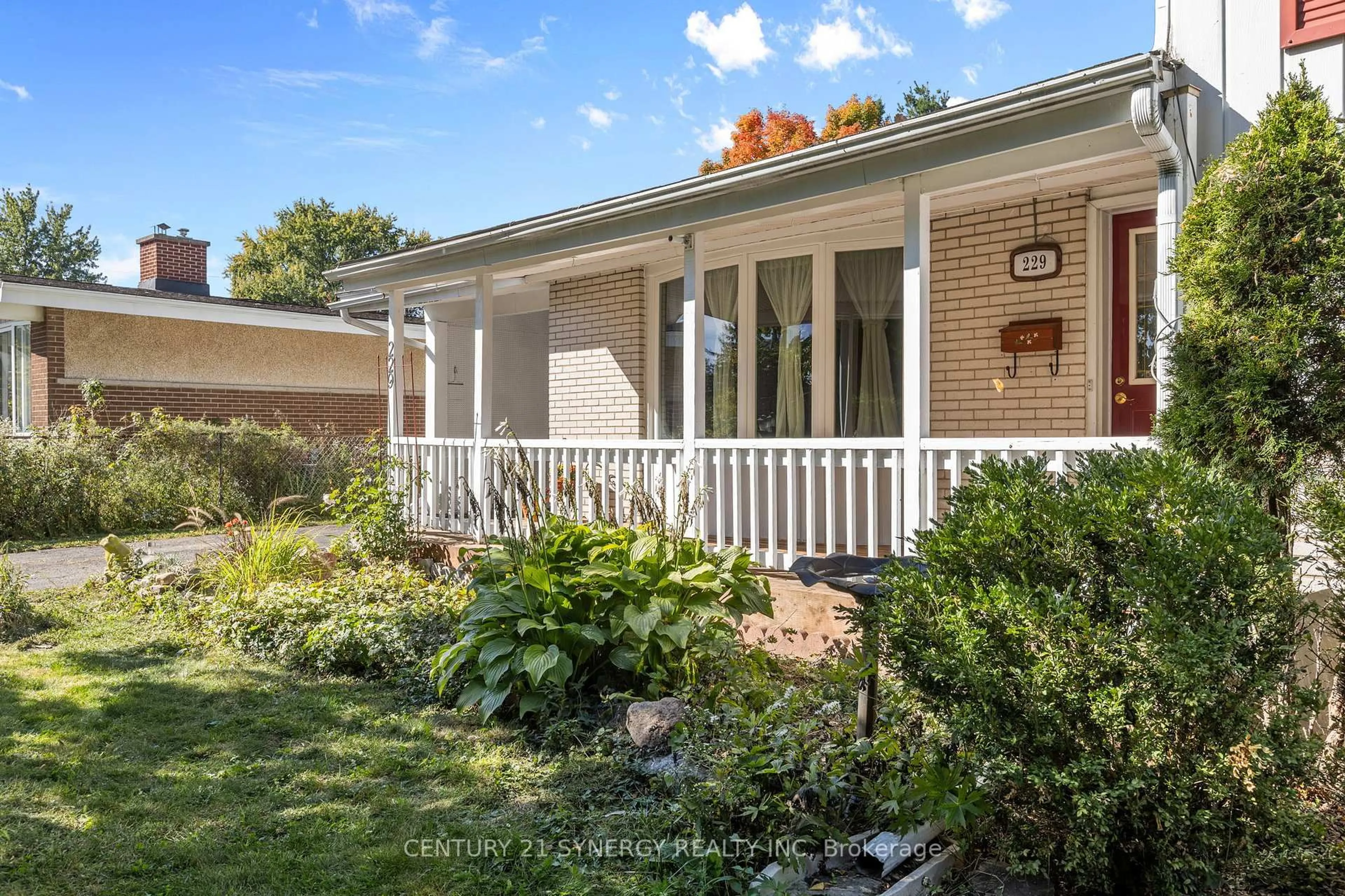 Home with vinyl exterior material, street for 229 Kennedy Lane, Ottawa Ontario K1E 1G5