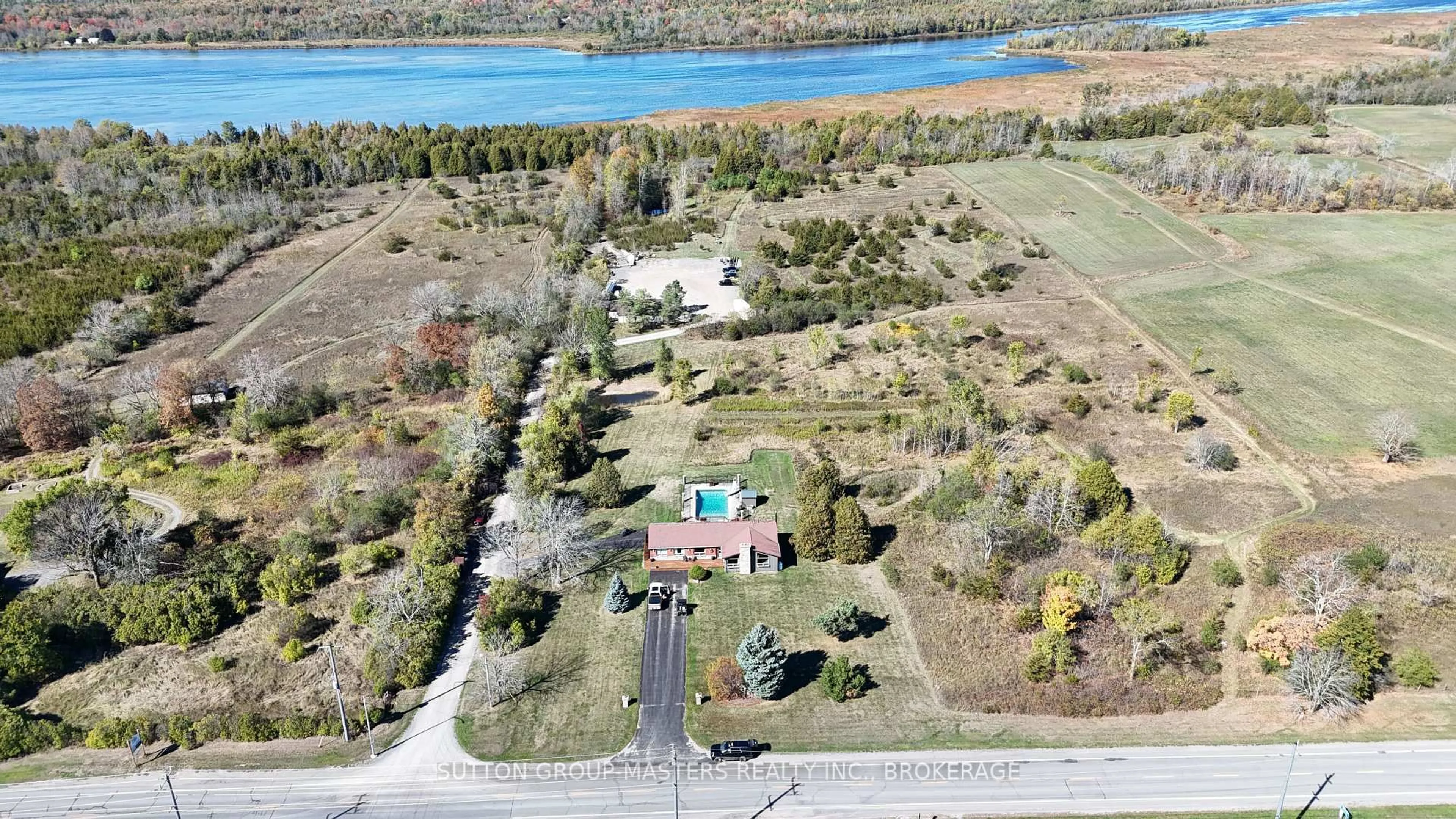 A pic from outside/outdoor area/front of a property/back of a property/a pic from drone, water/lake/river/ocean view for 4404 UNITY Rd, Bissett Creek Ontario K0H 2H0