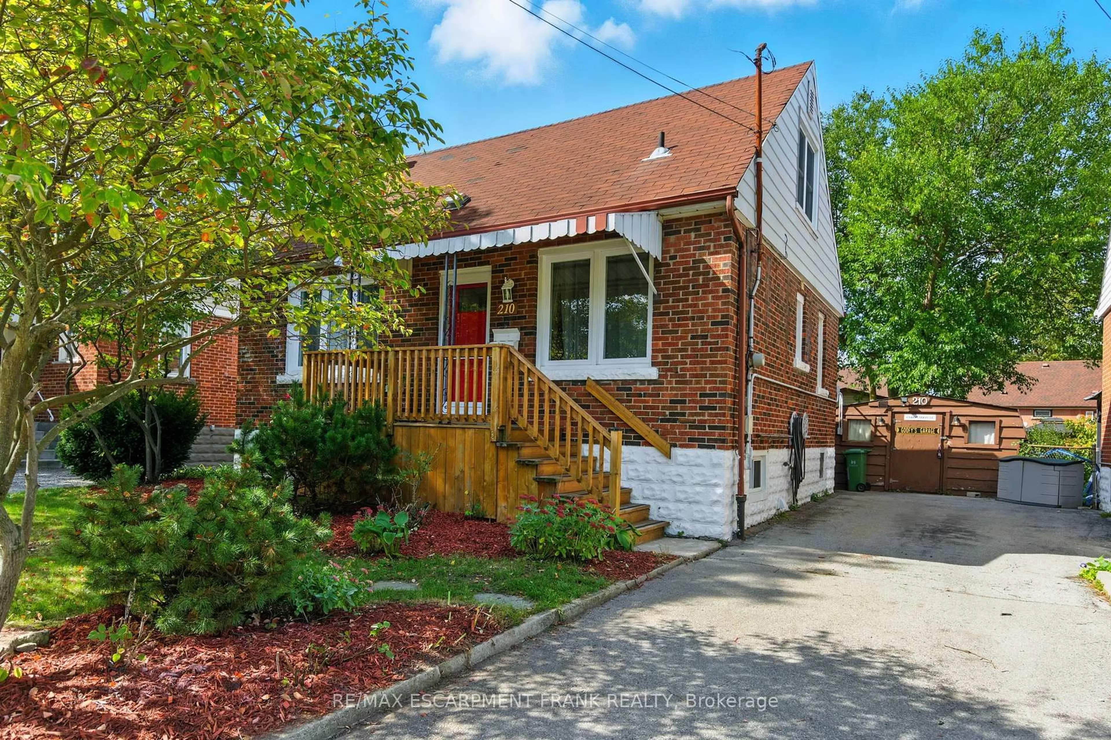 Home with brick exterior material, street for 210 EAST 12TH St, Hamilton Ontario L9A 3X6