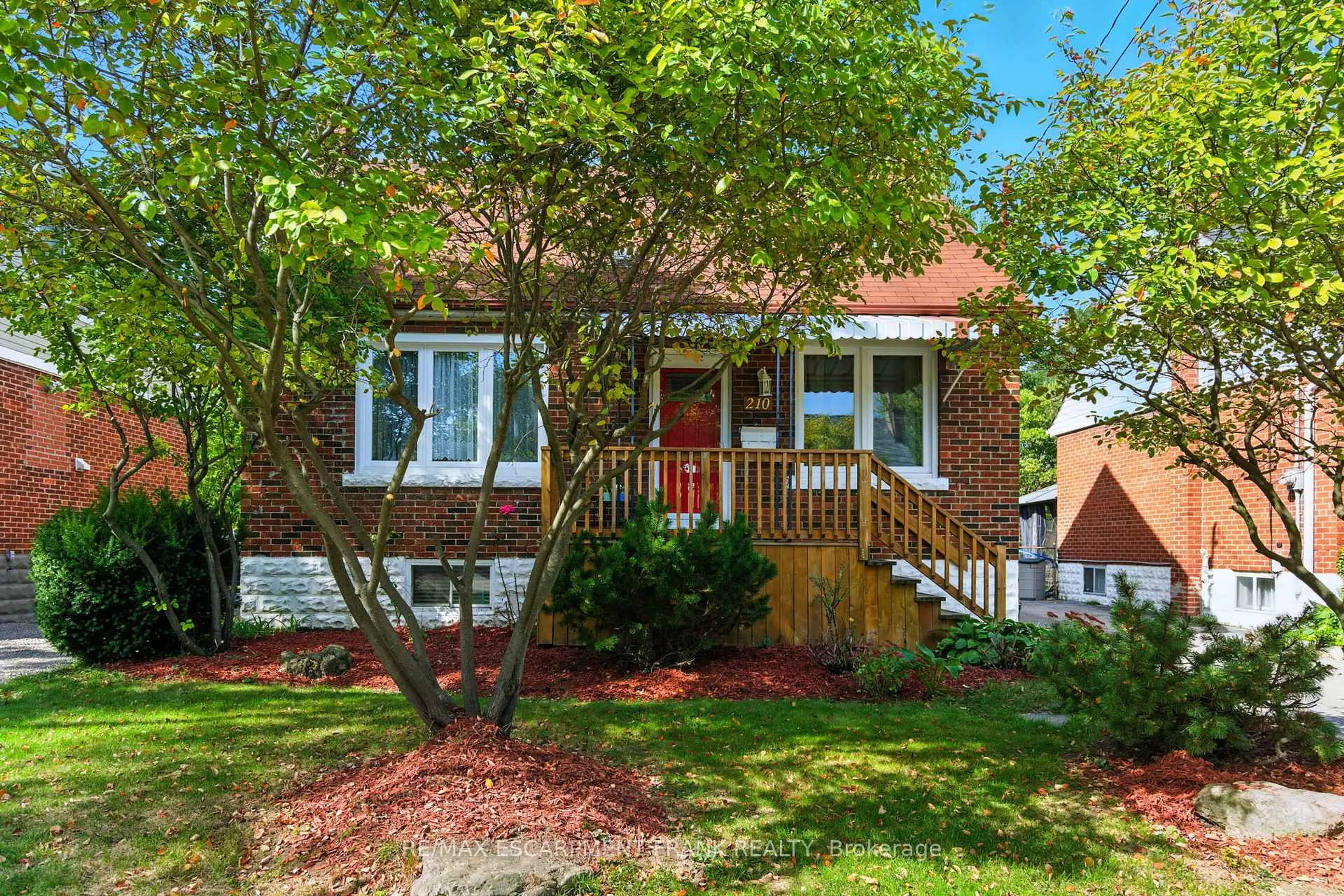 Home with brick exterior material, street for 210 EAST 12TH St, Hamilton Ontario L9A 3X6