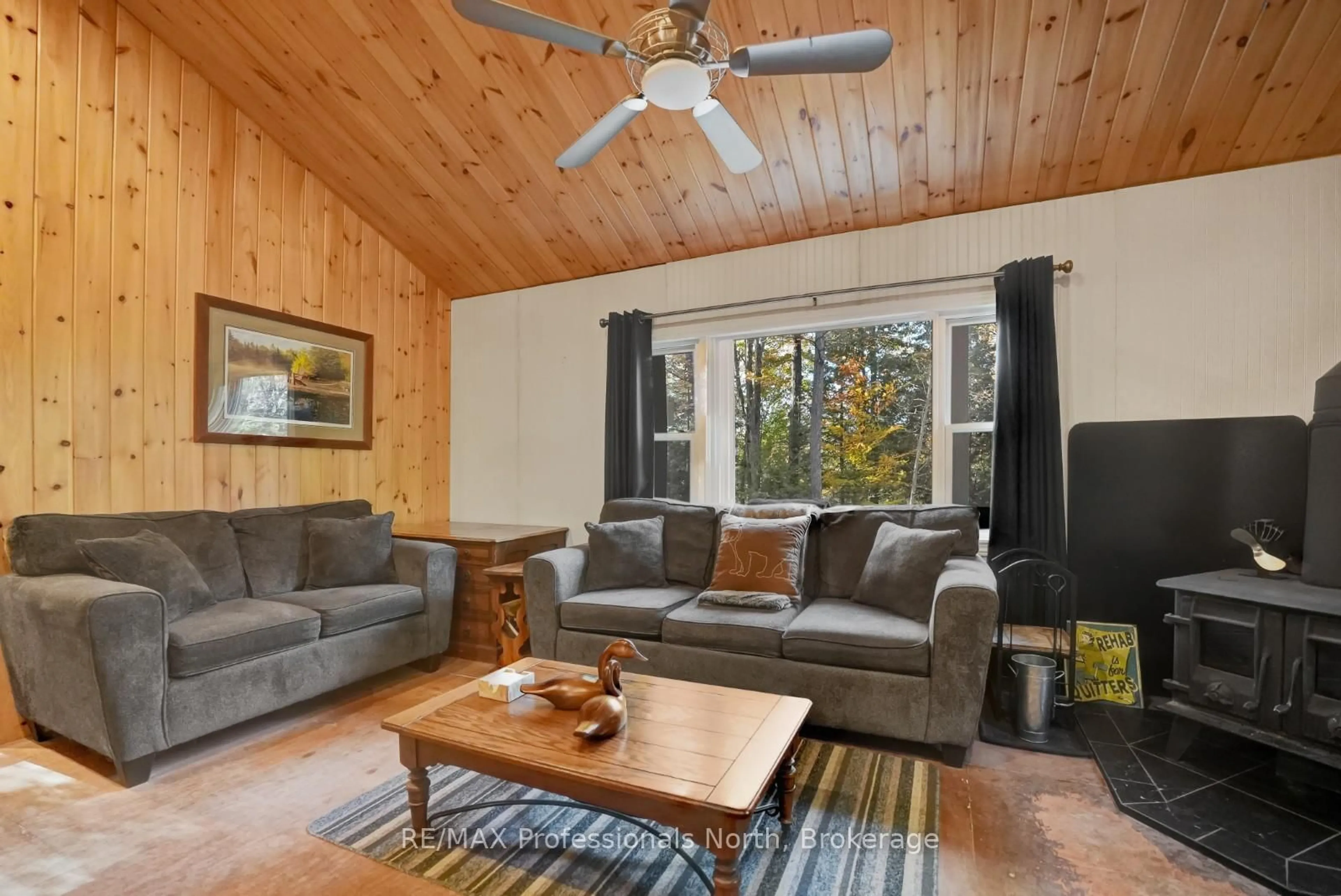 Living room with furniture, wood/laminate floor for 1196 Hagen Rd, Highlands East Ontario K0L 2A0