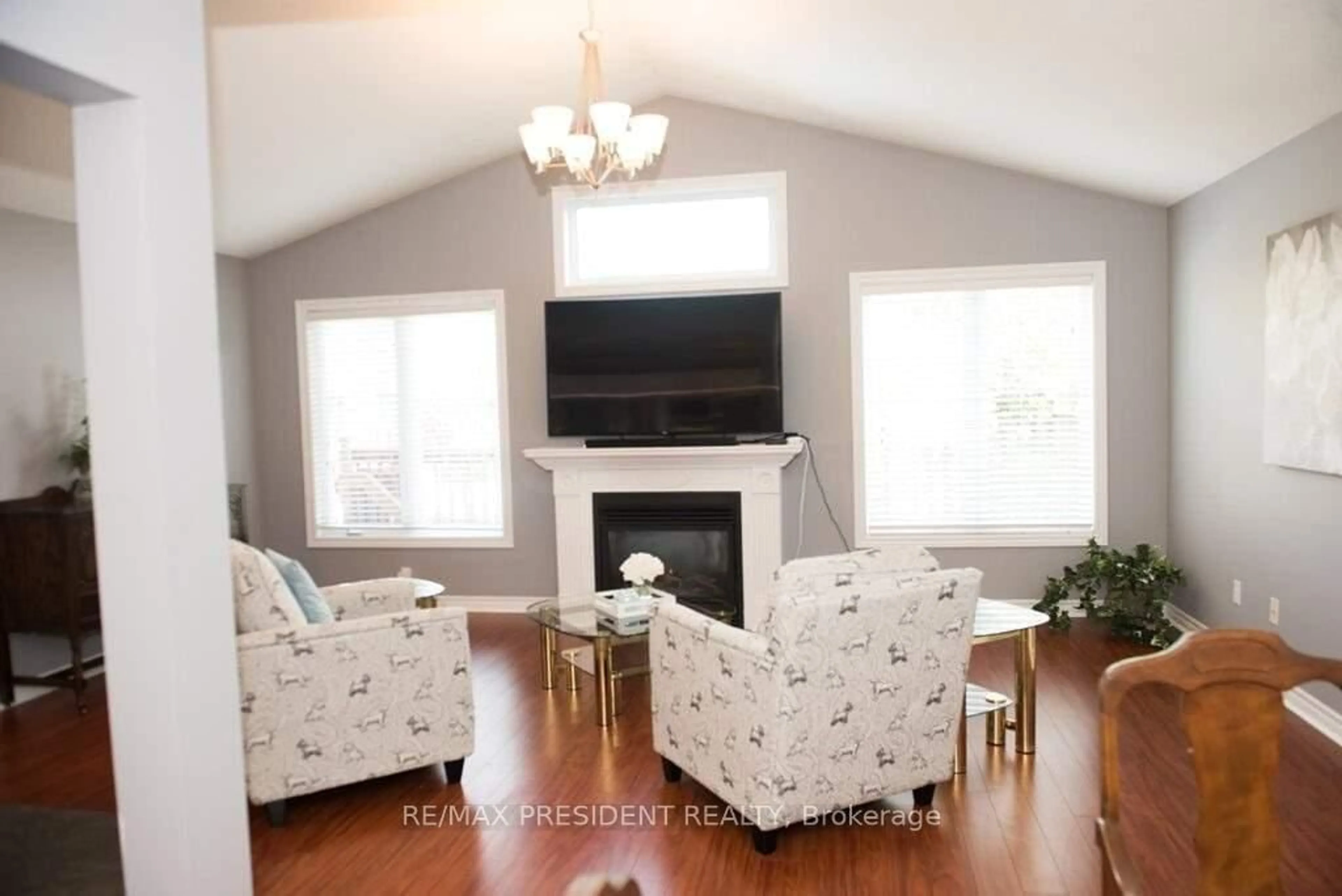 Living room with furniture, wood/laminate floor for 1657 Bayswater Cres, London North Ontario N6G 5N7