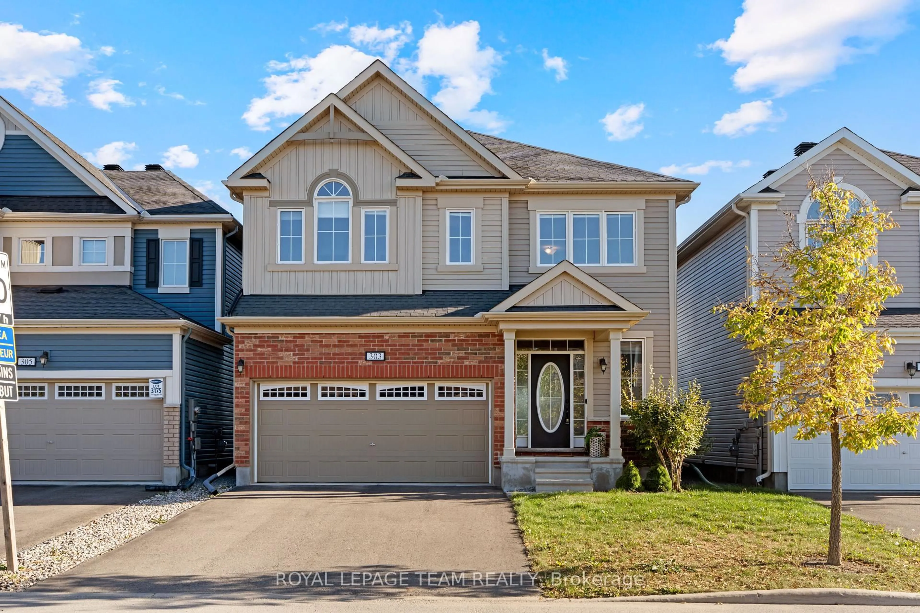 Home with vinyl exterior material, street for 303 Sweetclover Way, Ottawa Ontario K4A 1E5
