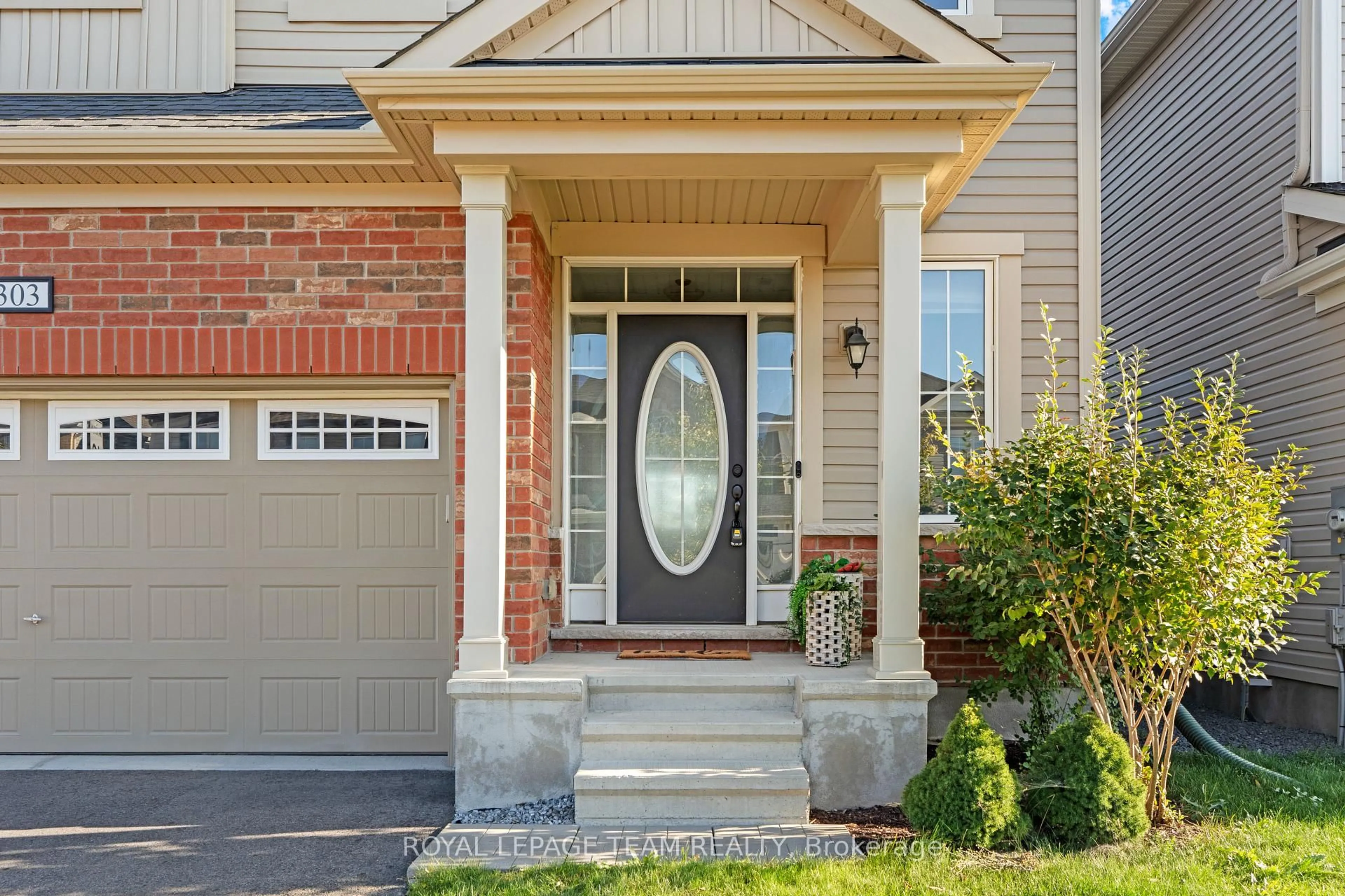 Home with brick exterior material, street for 303 Sweetclover Way, Ottawa Ontario K4A 1E5