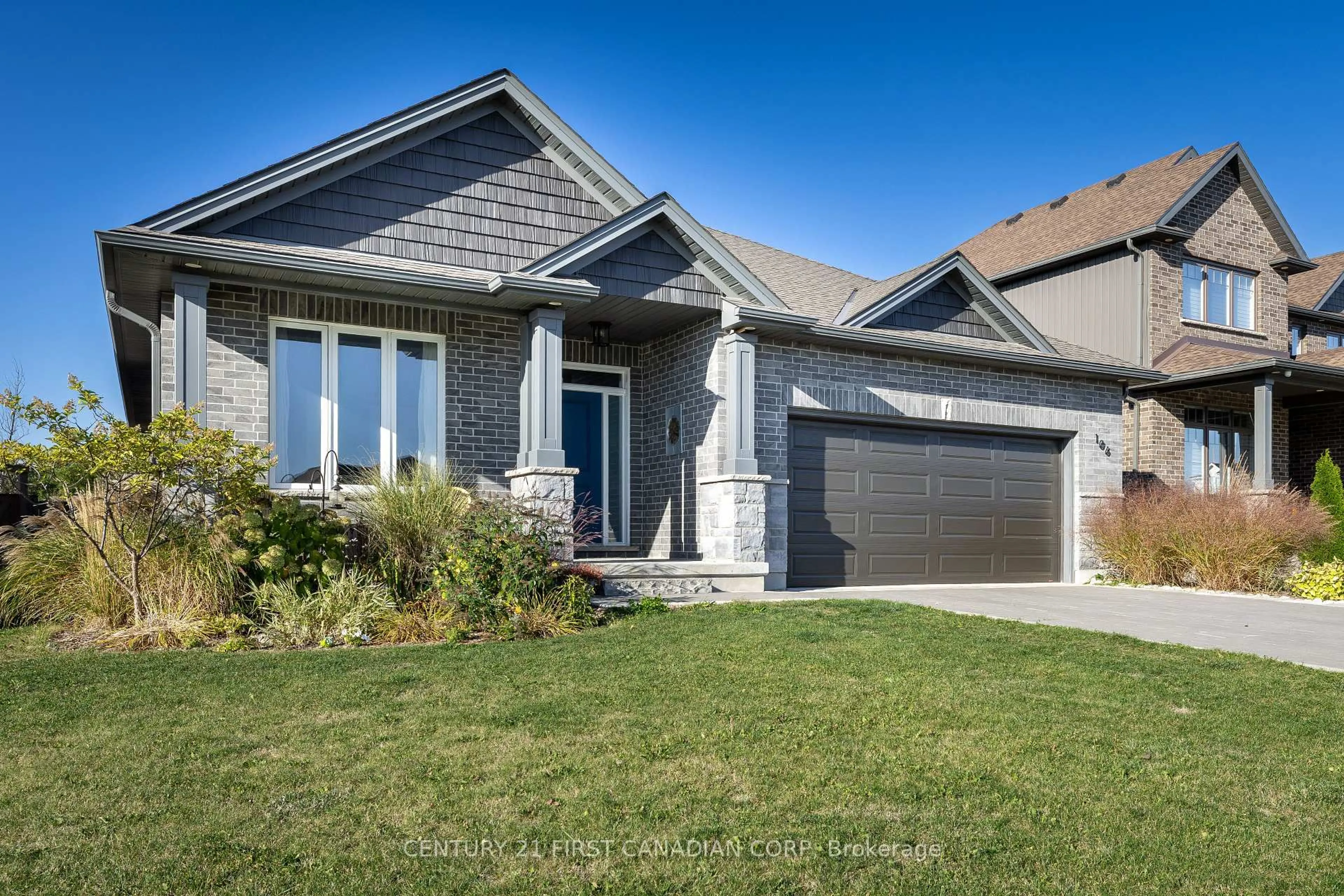 Home with vinyl exterior material, street for 106 Stuart Ave, Lucan Biddulph Ontario N0M 2J0