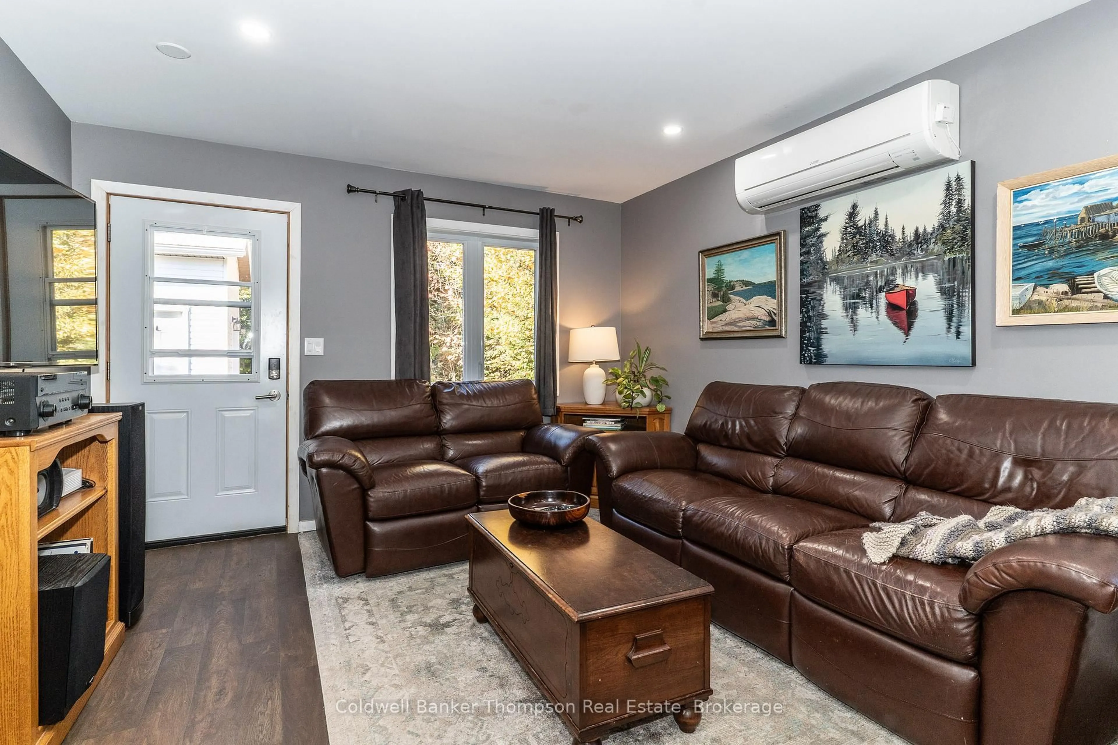 Living room with furniture, wood/laminate floor for 42 Murray St, Sundridge Ontario P0A 1Z0
