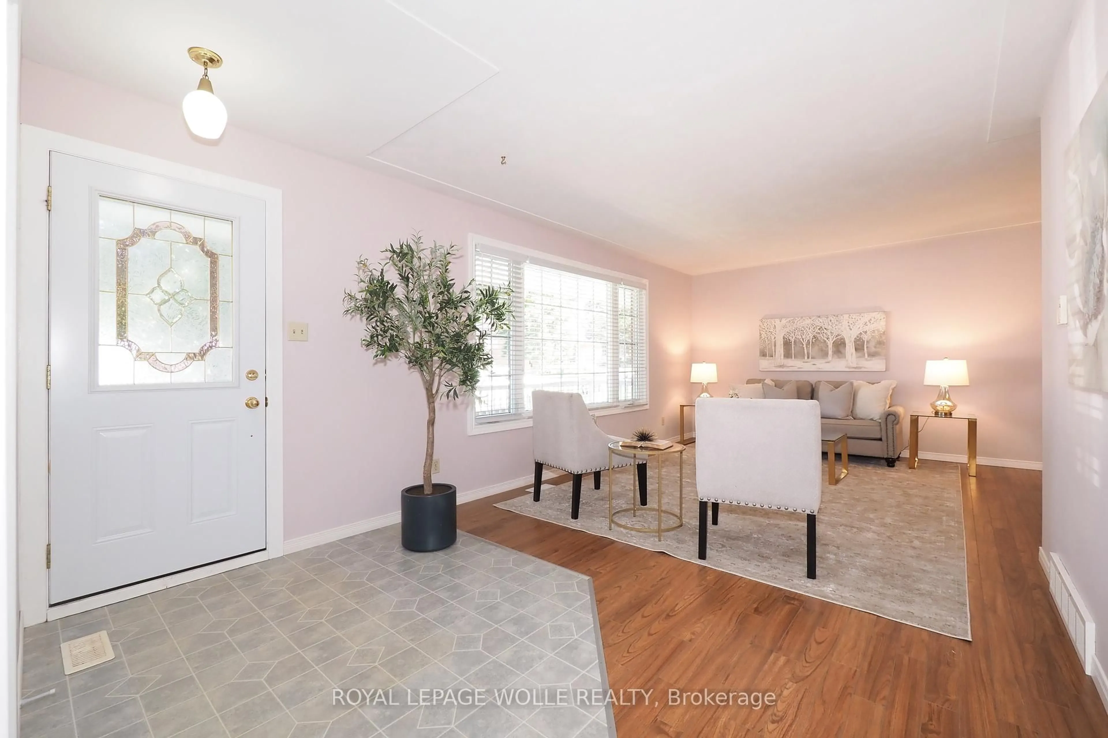 Living room with furniture, wood/laminate floor for 44 Hampton St, Woolwich Ontario N3B 1L7