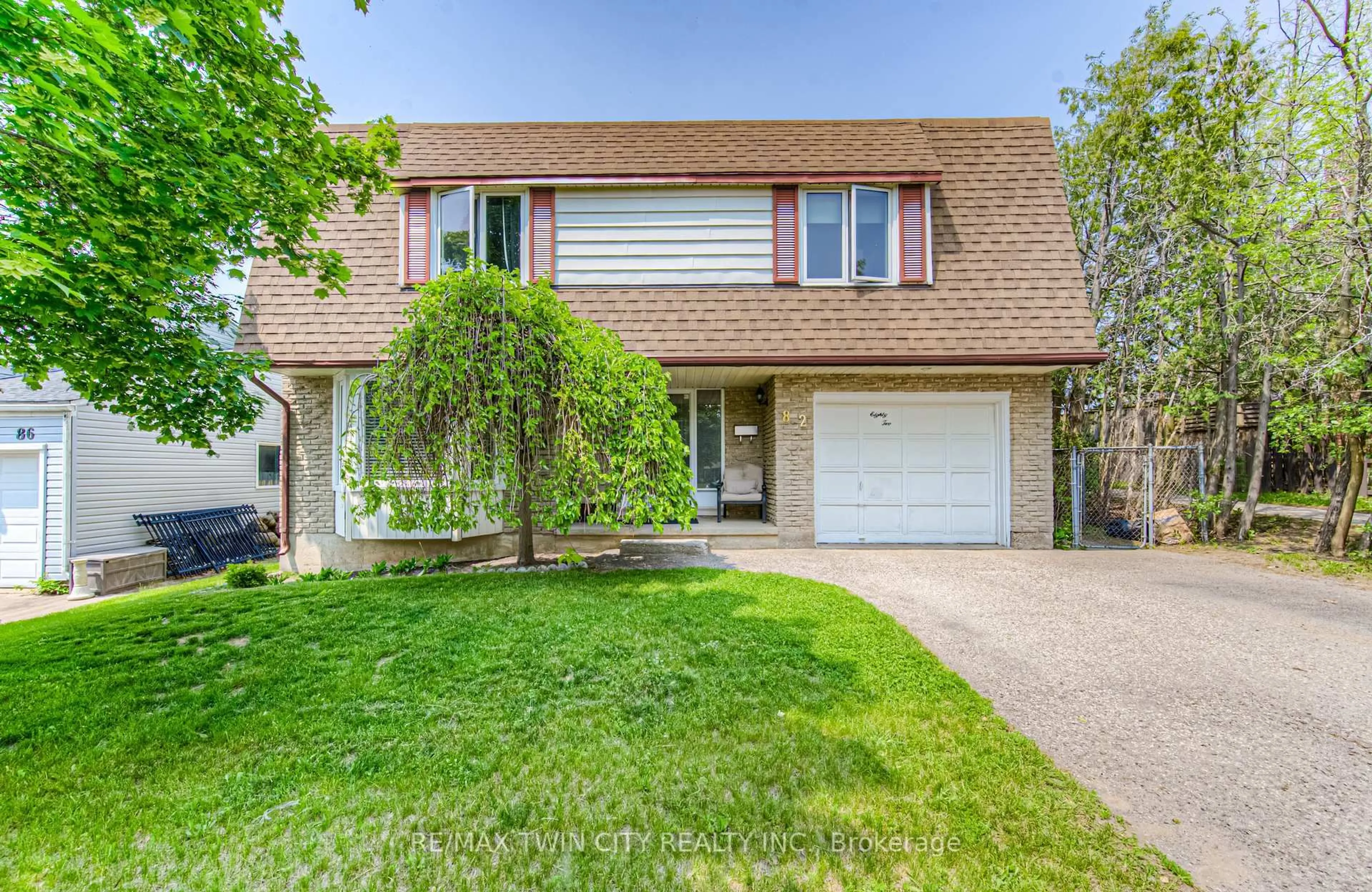 Home with vinyl exterior material, street for 82 Roseneath Cres, Kitchener Ontario N2E 1V9