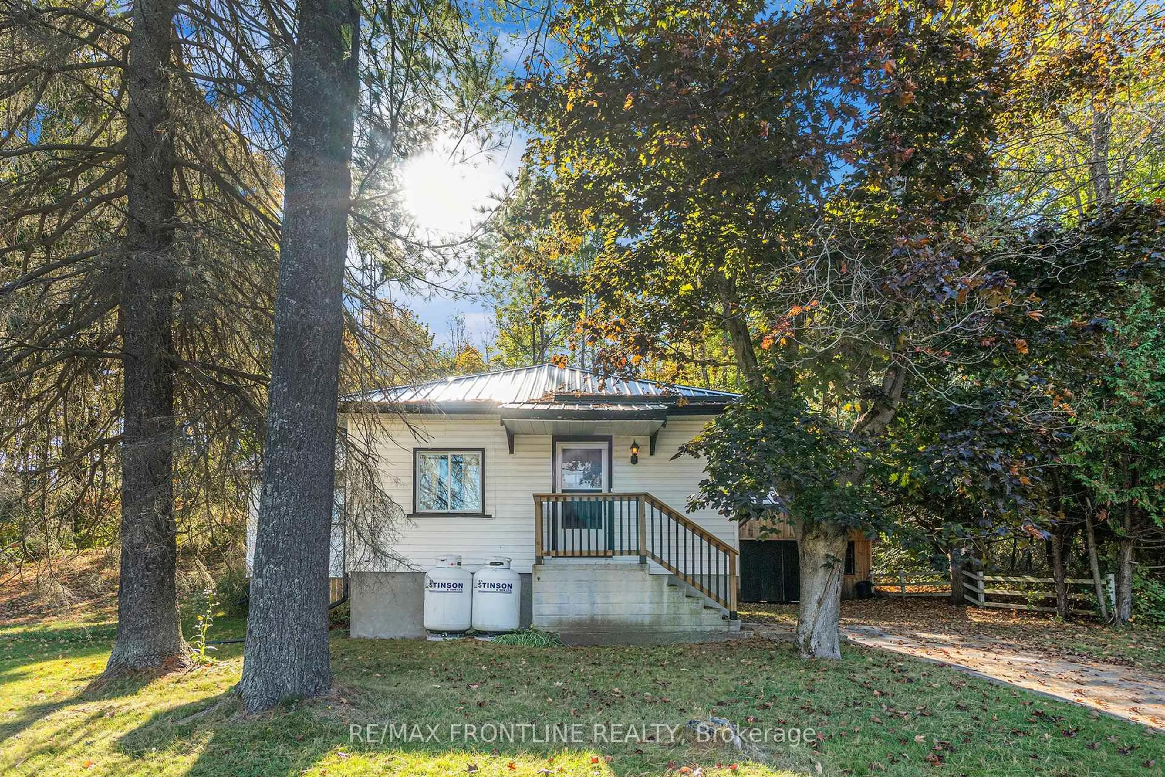 A pic from outside/outdoor area/front of a property/back of a property/a pic from drone, street for 22053 Hwy 7, Maberly Ontario K0H 2B0