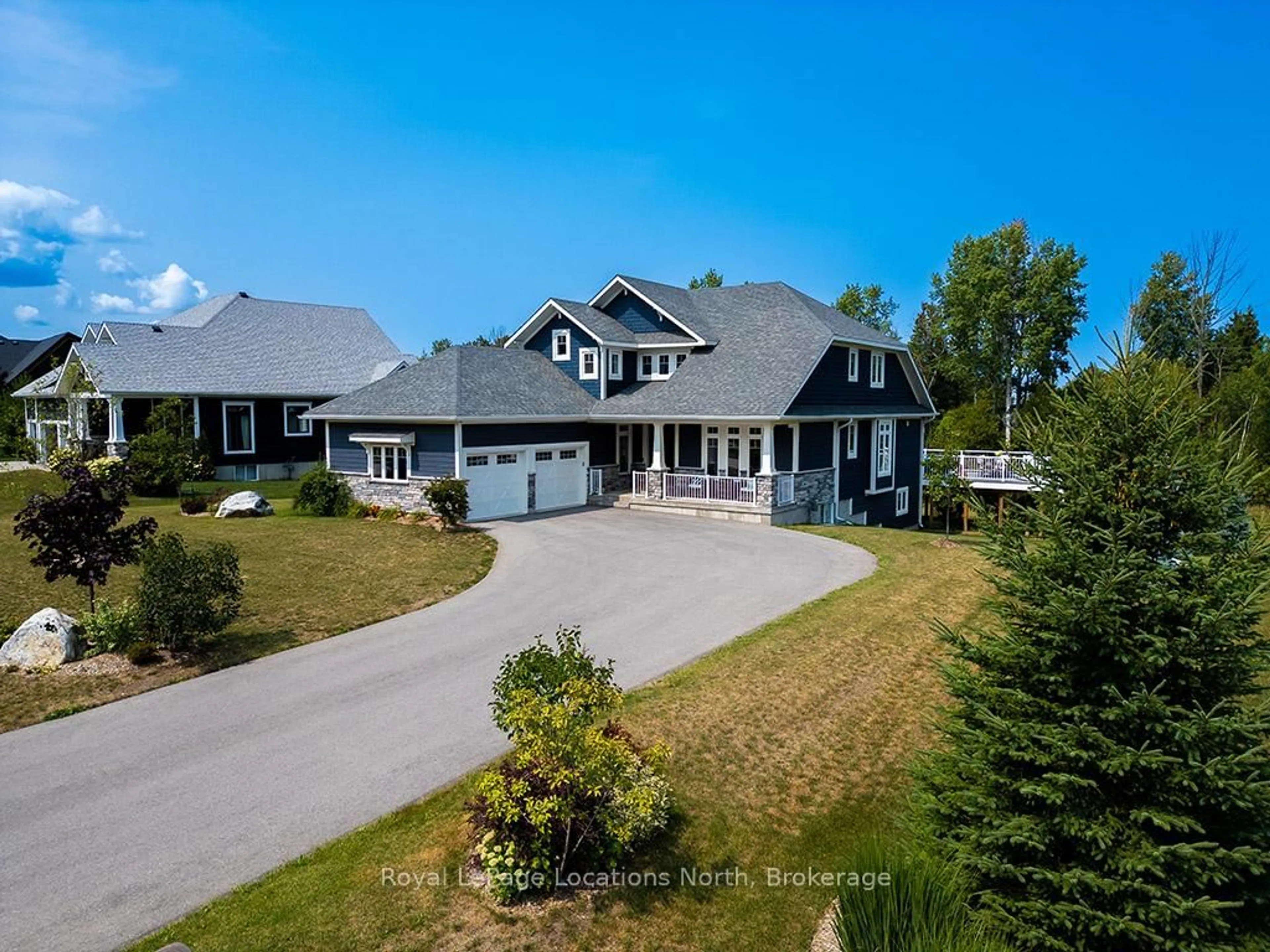 A pic from outside/outdoor area/front of a property/back of a property/a pic from drone, unknown for 128 Timber Lane, Blue Mountains Ontario N0H 2P0